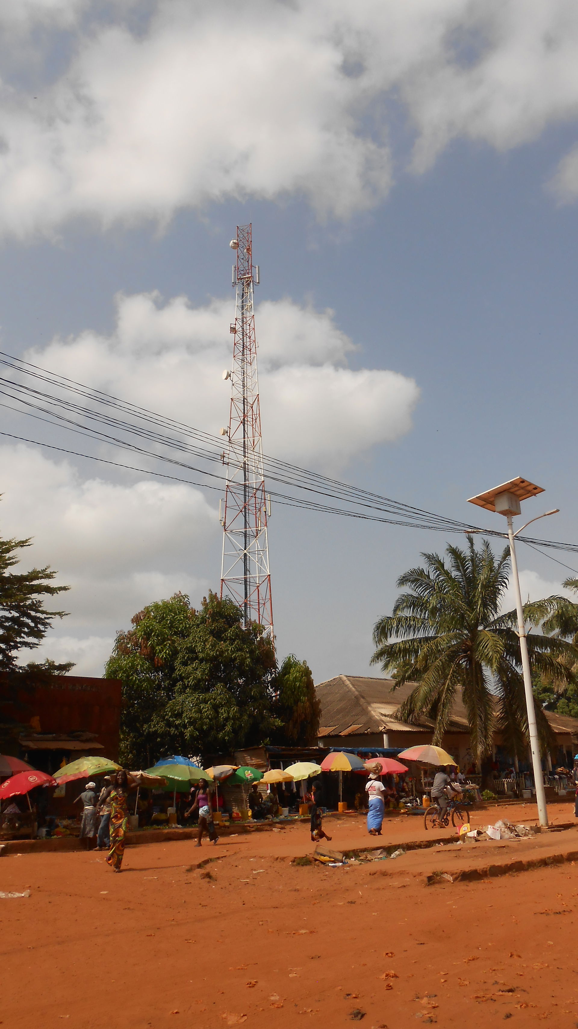 Antenna mast in the town centre of Canchungo, near the market h…