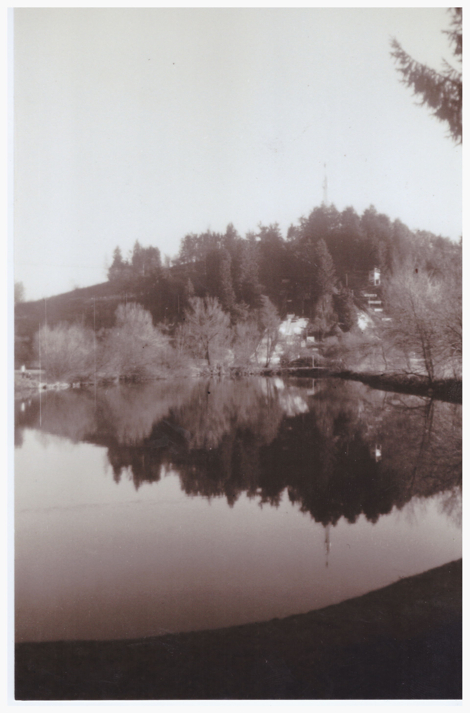 Black and white photograph of the hill "sekirica" in logatec, s…