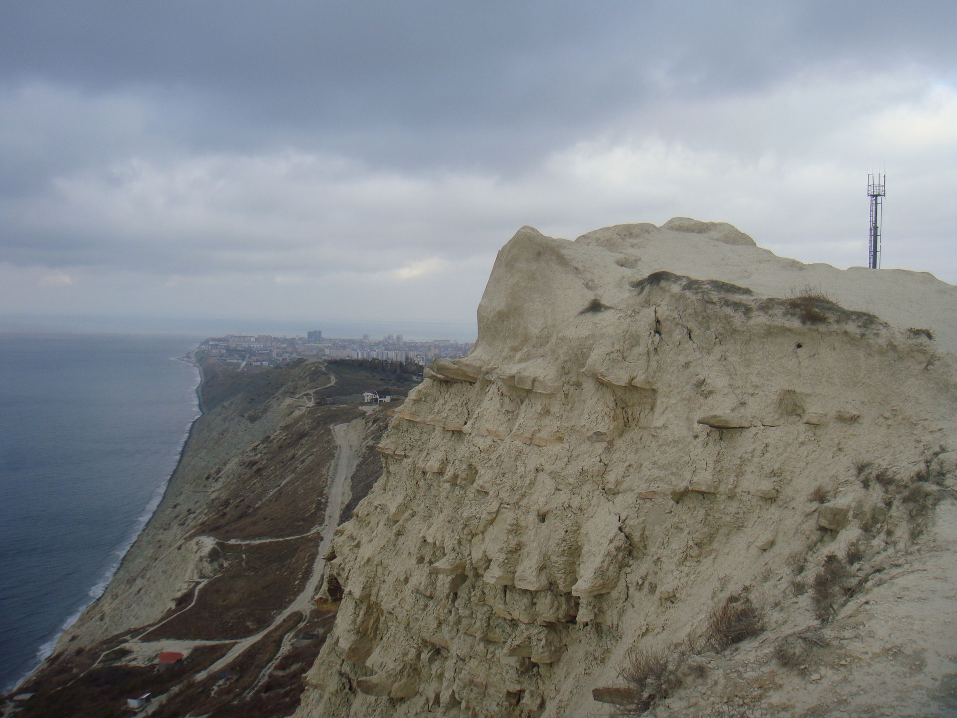 The photo shows the high coast of the Black Sea coast. The city…