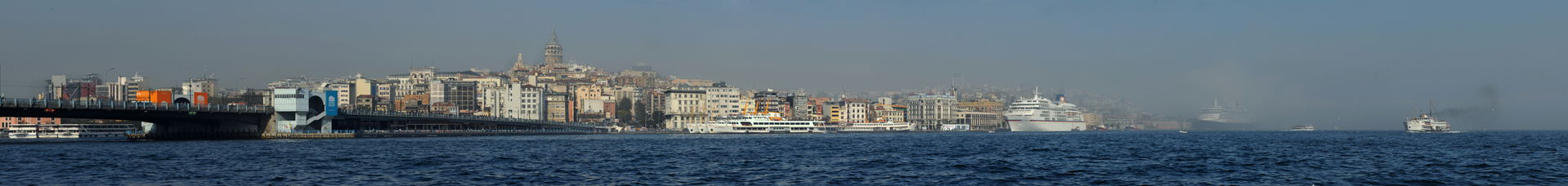 Panorama of Istanbul under fog. With Galata Tower in the center.