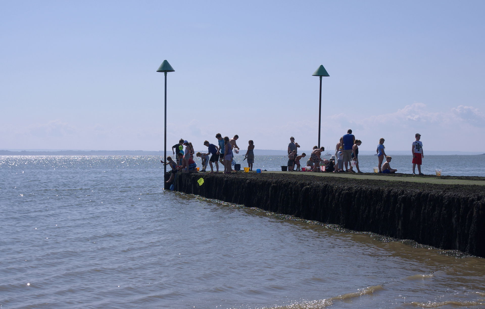 Children fish from a jetty in Chalkwell, Southend-on-Sea.