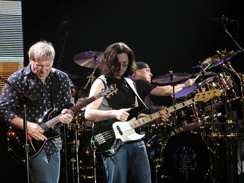 Peart (right) performing with Rush.