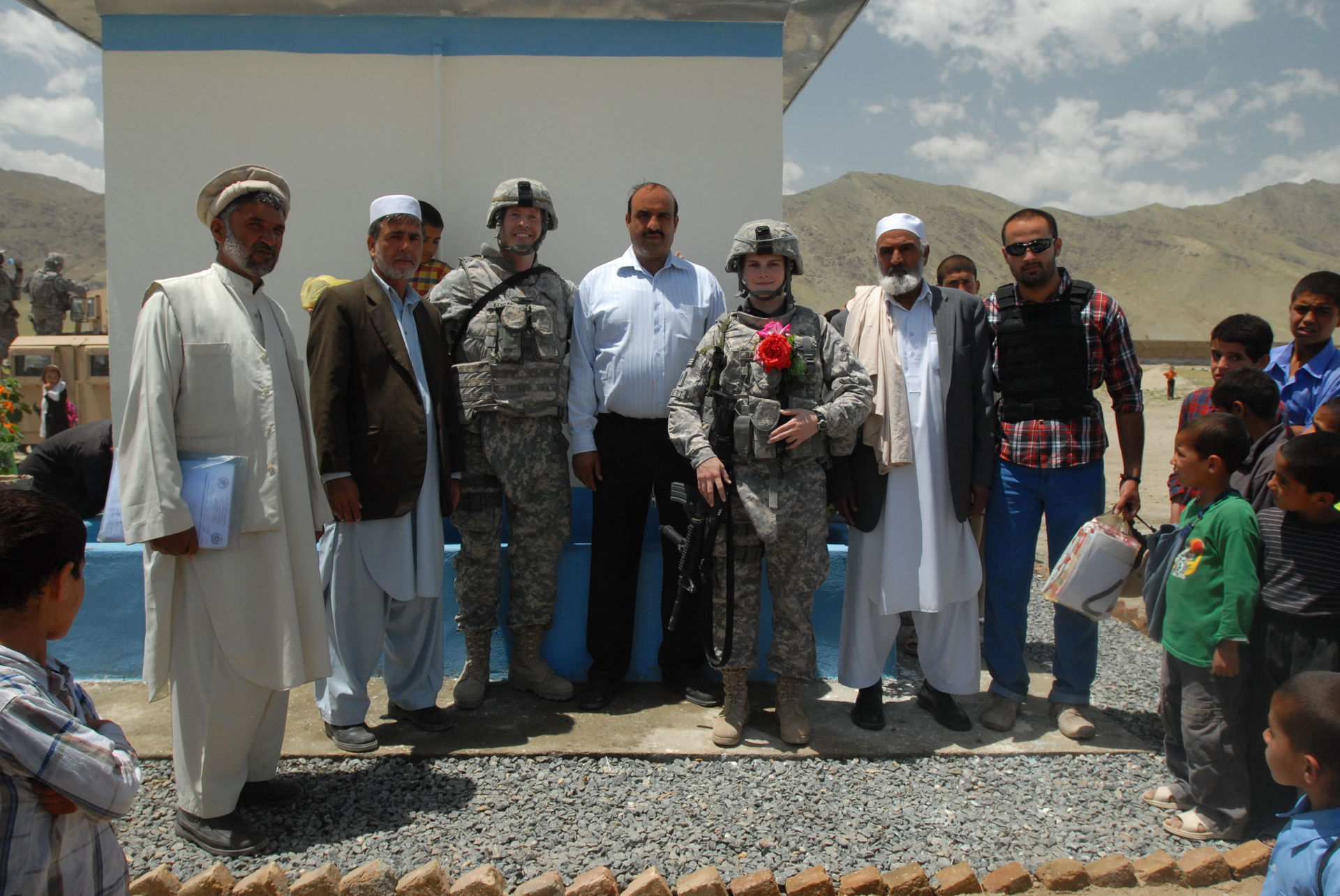 Members from the Ministry of Education and Soldiers from Camp P…