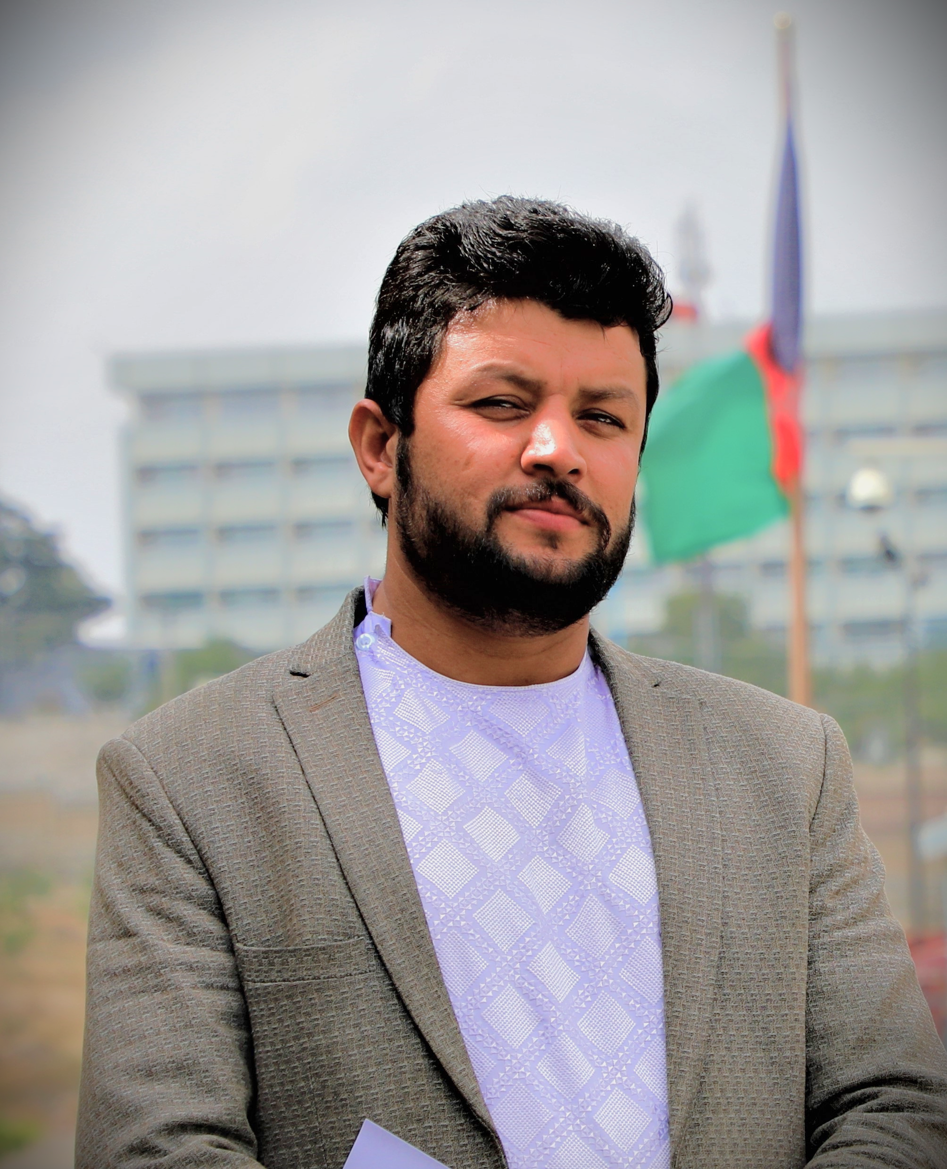 This is a portrait of Noor Alam Hanif Safi, an Afghan journalis…