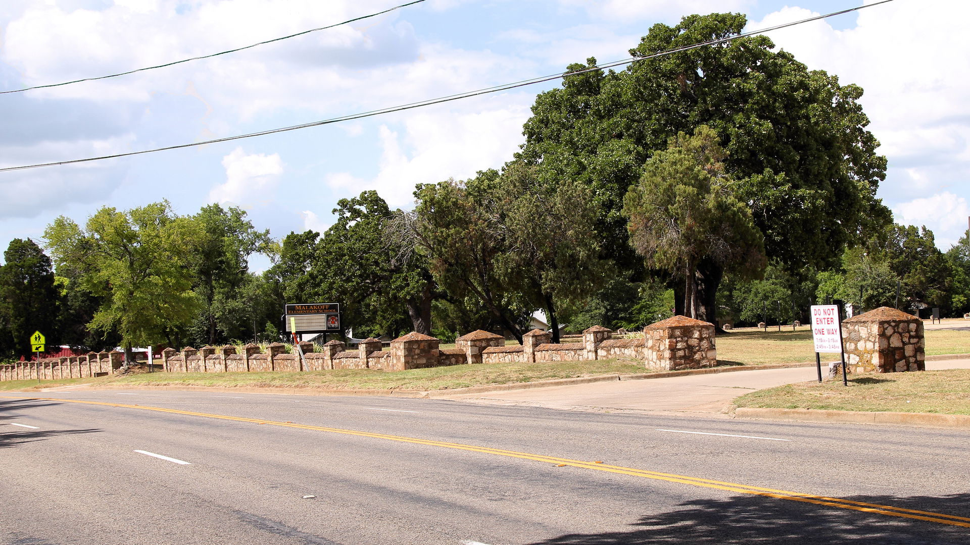 More of the perimeter wall around Malakoff Elementary School in…