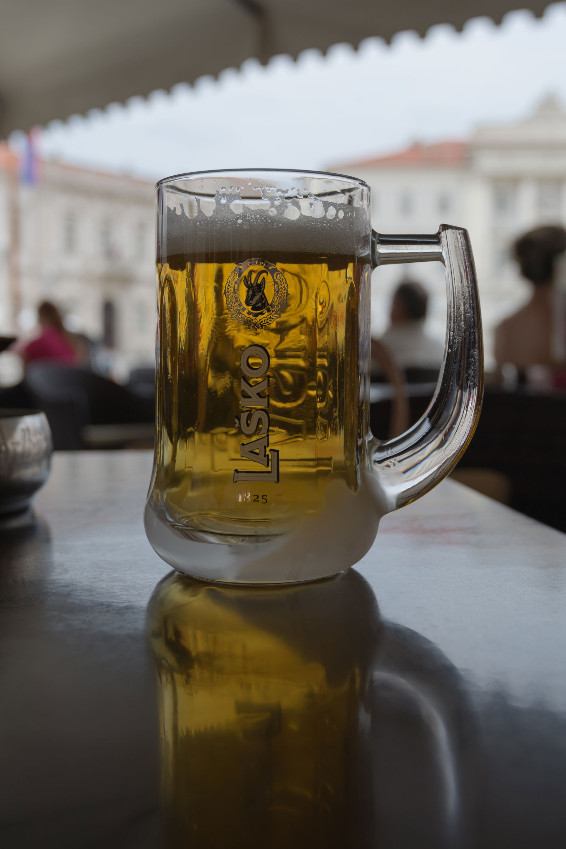 This beer, a Laško Zlatorog, was served in an ice cold glass.