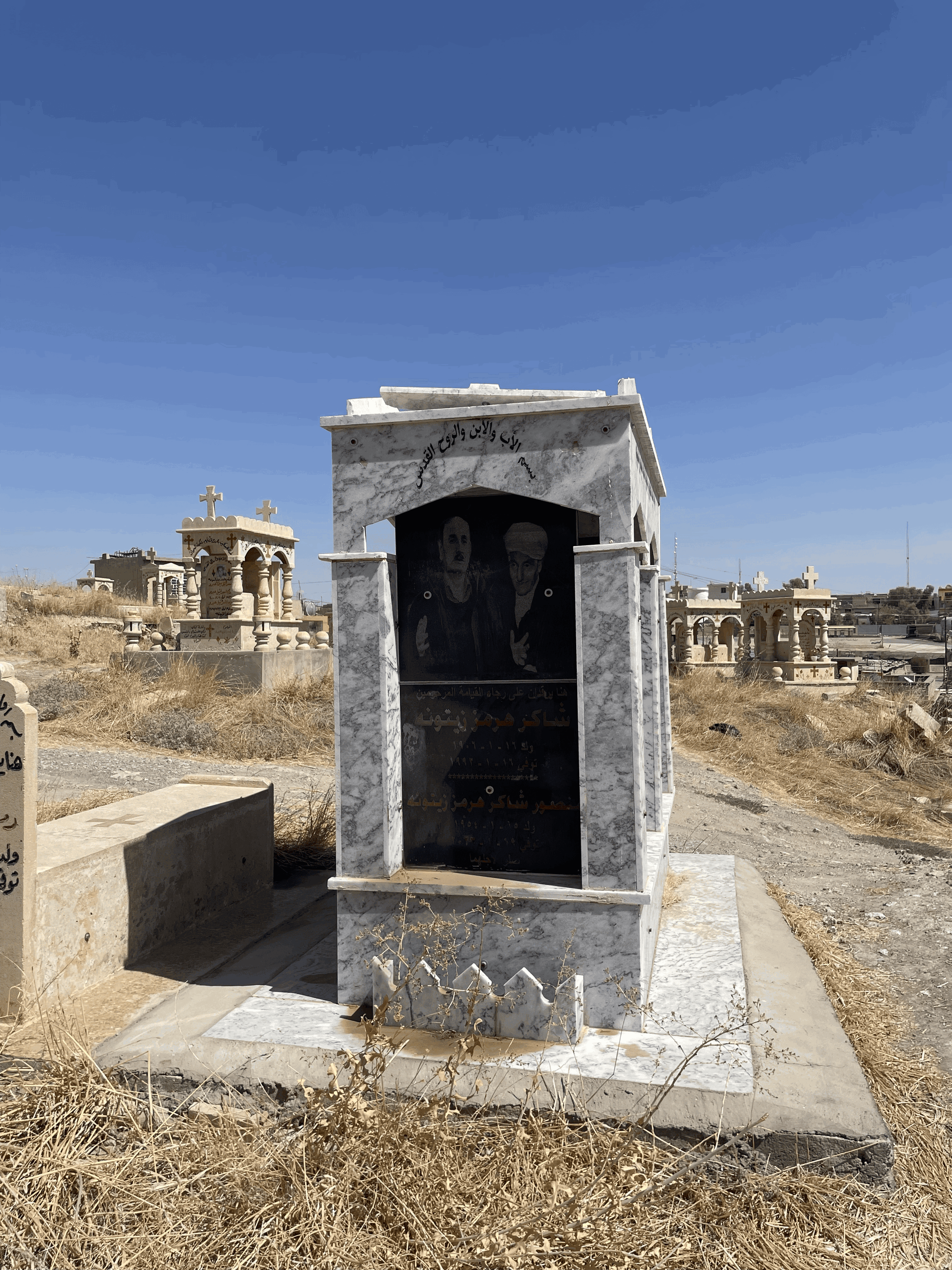 A picture of a detailed gravestone in the Tel Keppe Cemetery, w…