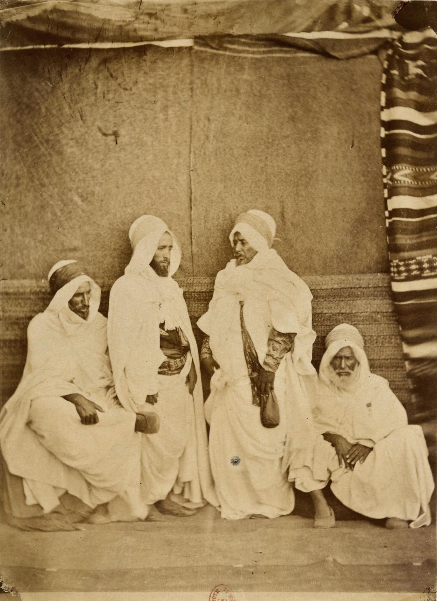 (From right to left): • Hājj Muhammad, qā'id of the Zmālah •…