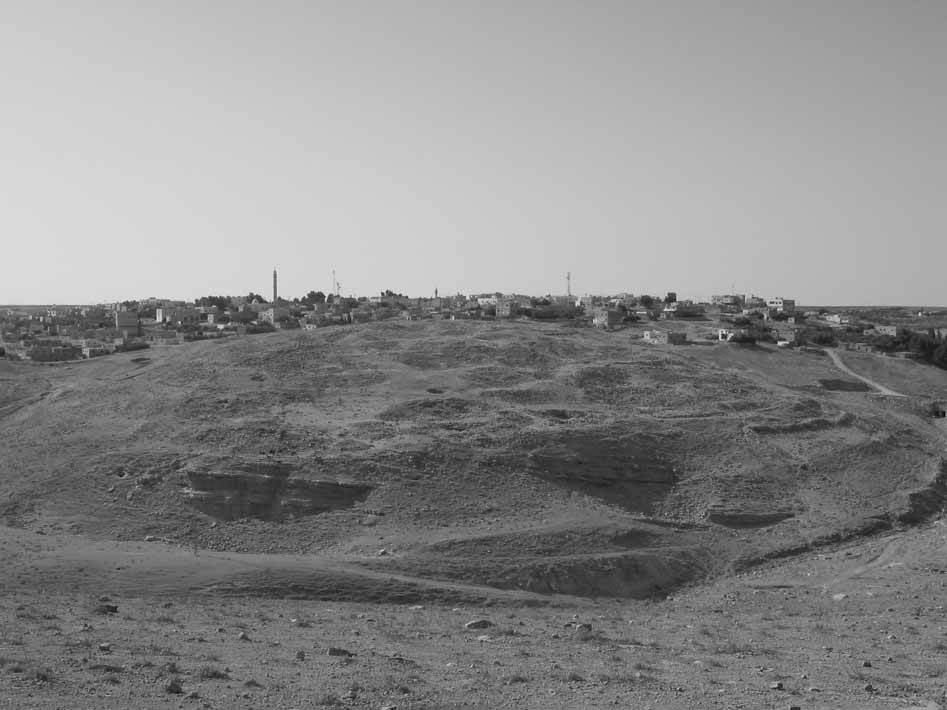 modern Dhiban with ancient Dhiban in the foreground, looking so…