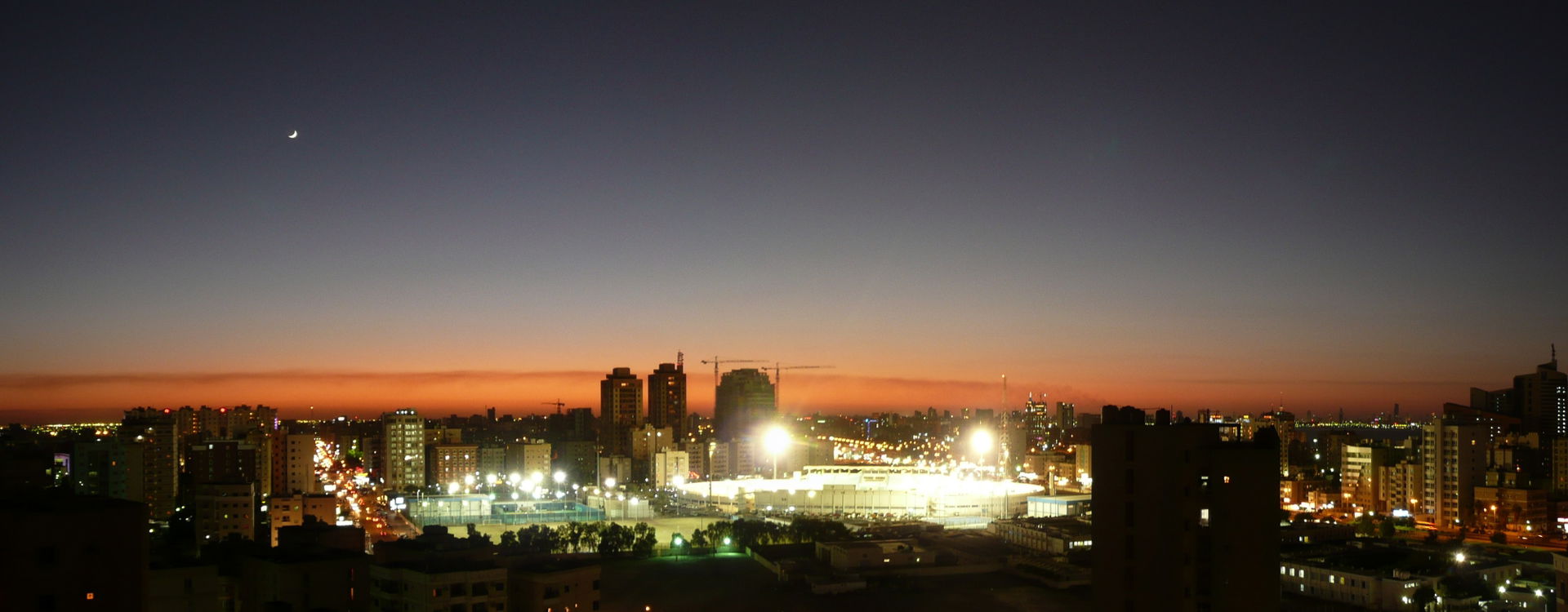 A stitched panorama of the evening view from our living room ba…