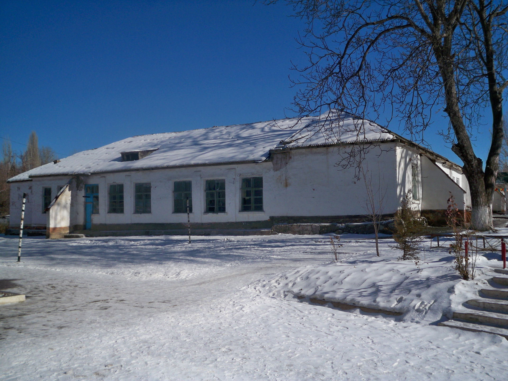 The old building of Toktogul Secondary School. Isfana, Kyrgyzst…