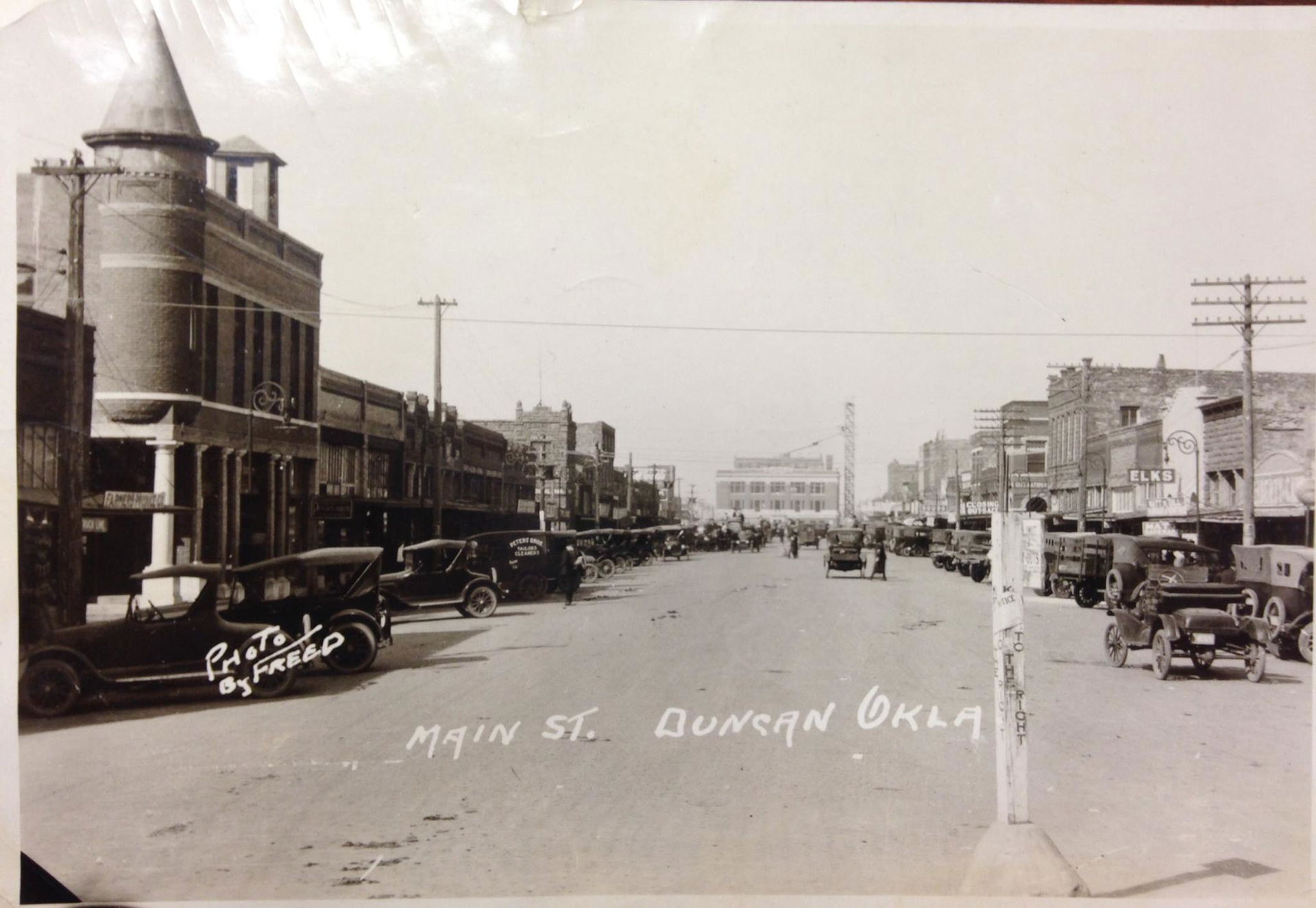 Looking west down Main St. The building with the turret on the …