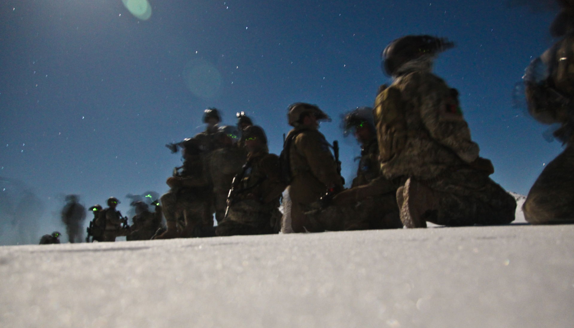 Coalition security force members provide security during  an op…