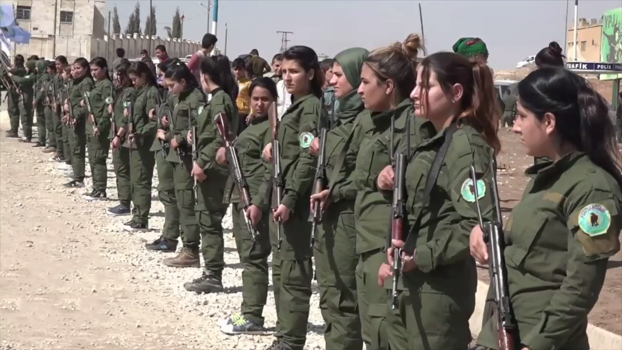 Members of the Rojava police force (Asayish) in the city of Kob…