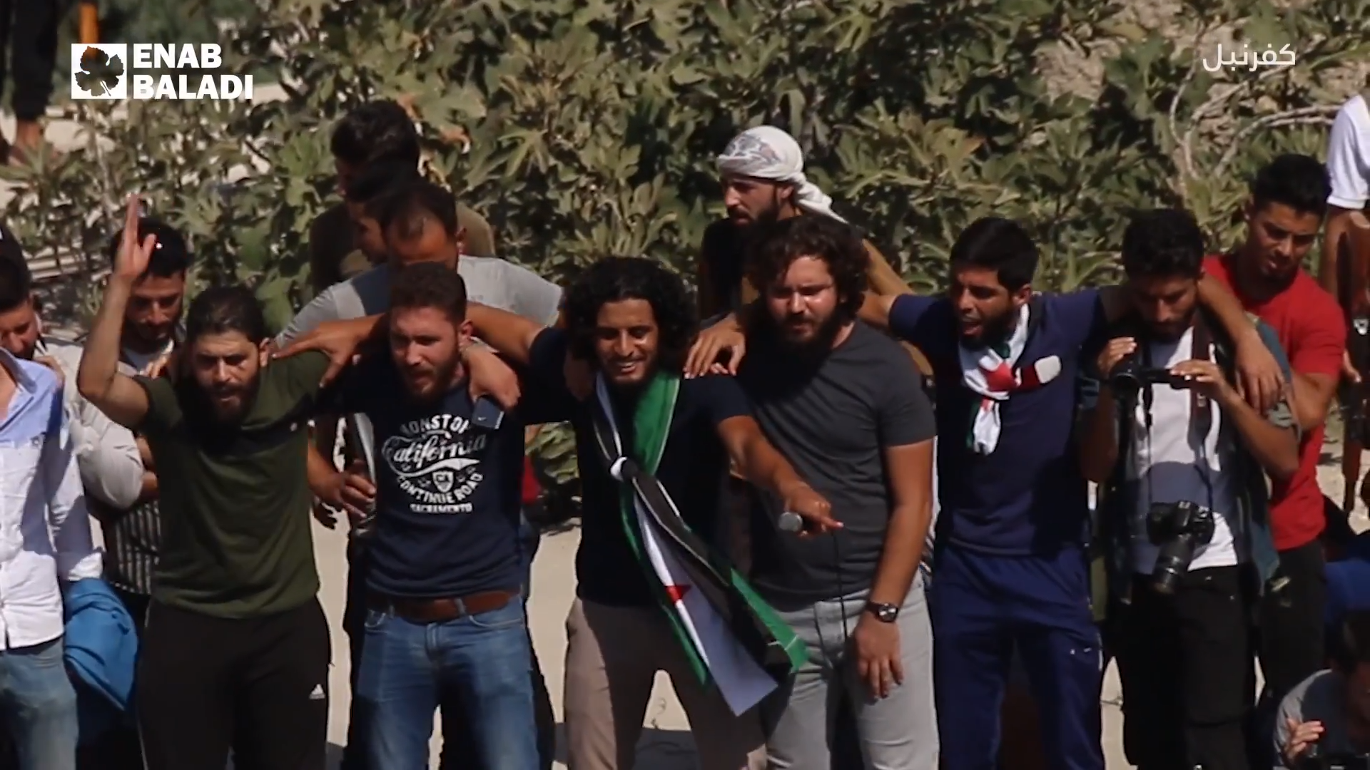 Syrian rebel leader Abdul Baset al-Sarout (center with flag) du…