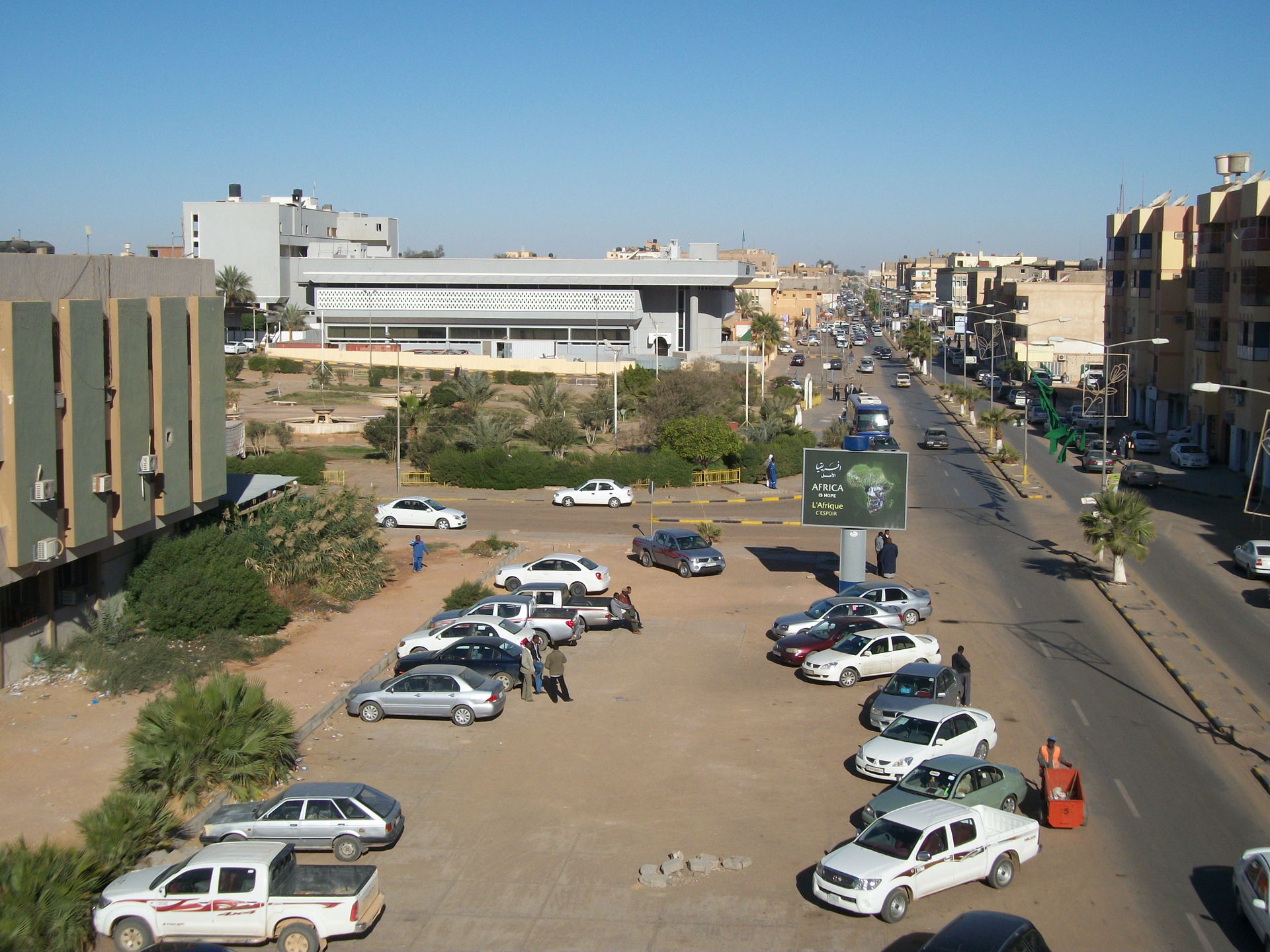 Sebha, Fezzan, Lybia. City centre. Main avenue, parking lot and…