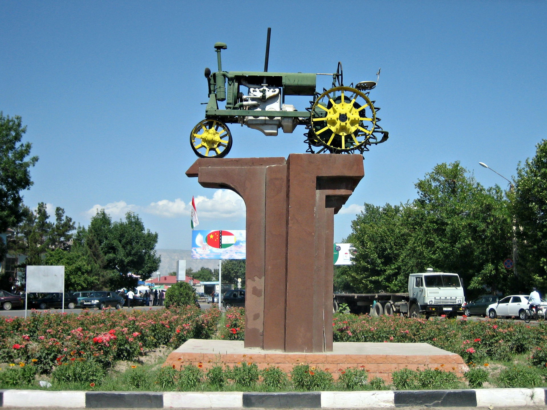 Tractor monument in Bokhtar, Pervomu Traktoru Vakhshskoy Doliny