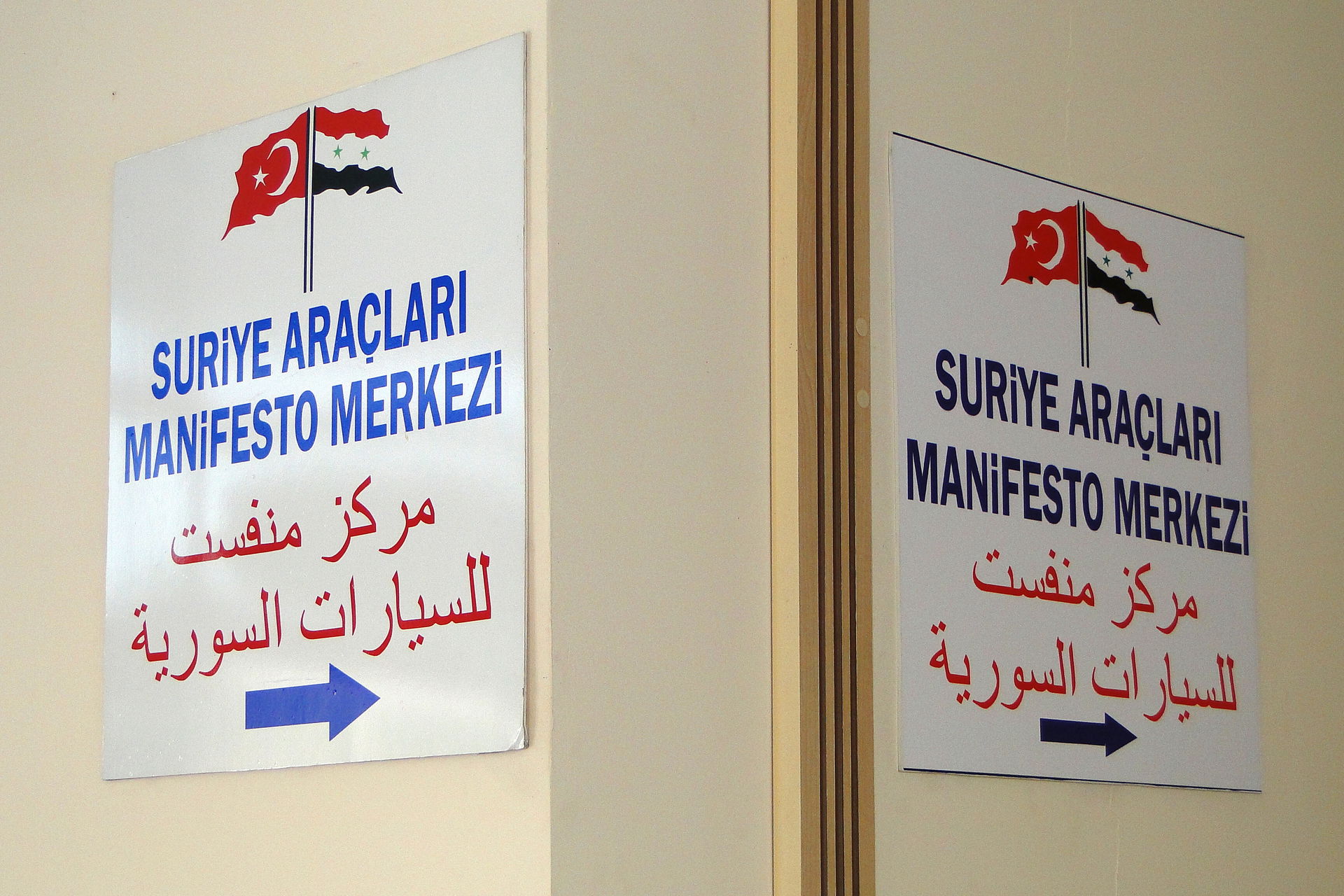 Sign showing where to register Syrian-plated cars in the border…