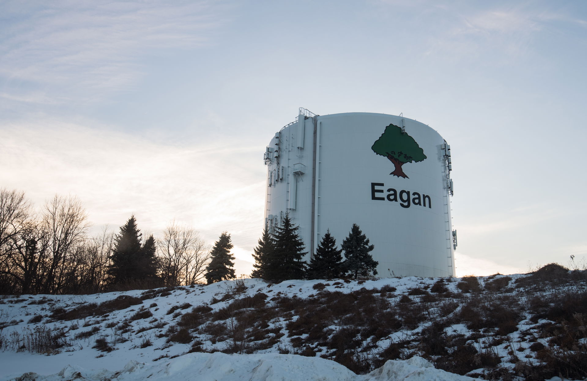 A City of Eagan, Minnesota watertower at sunset in winter.