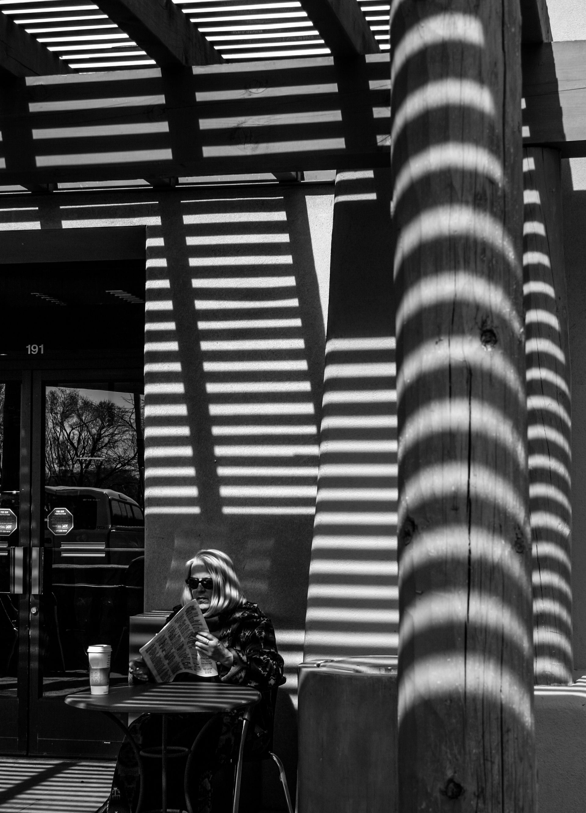 An array of shadows on the patio of Starbucks, Santa Fe, NM