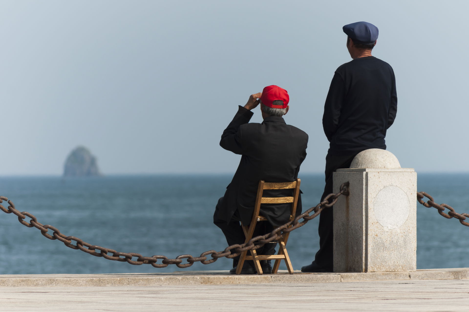 Dalian, Liaoning, China: Two elderly Chinese guys enjoying the …