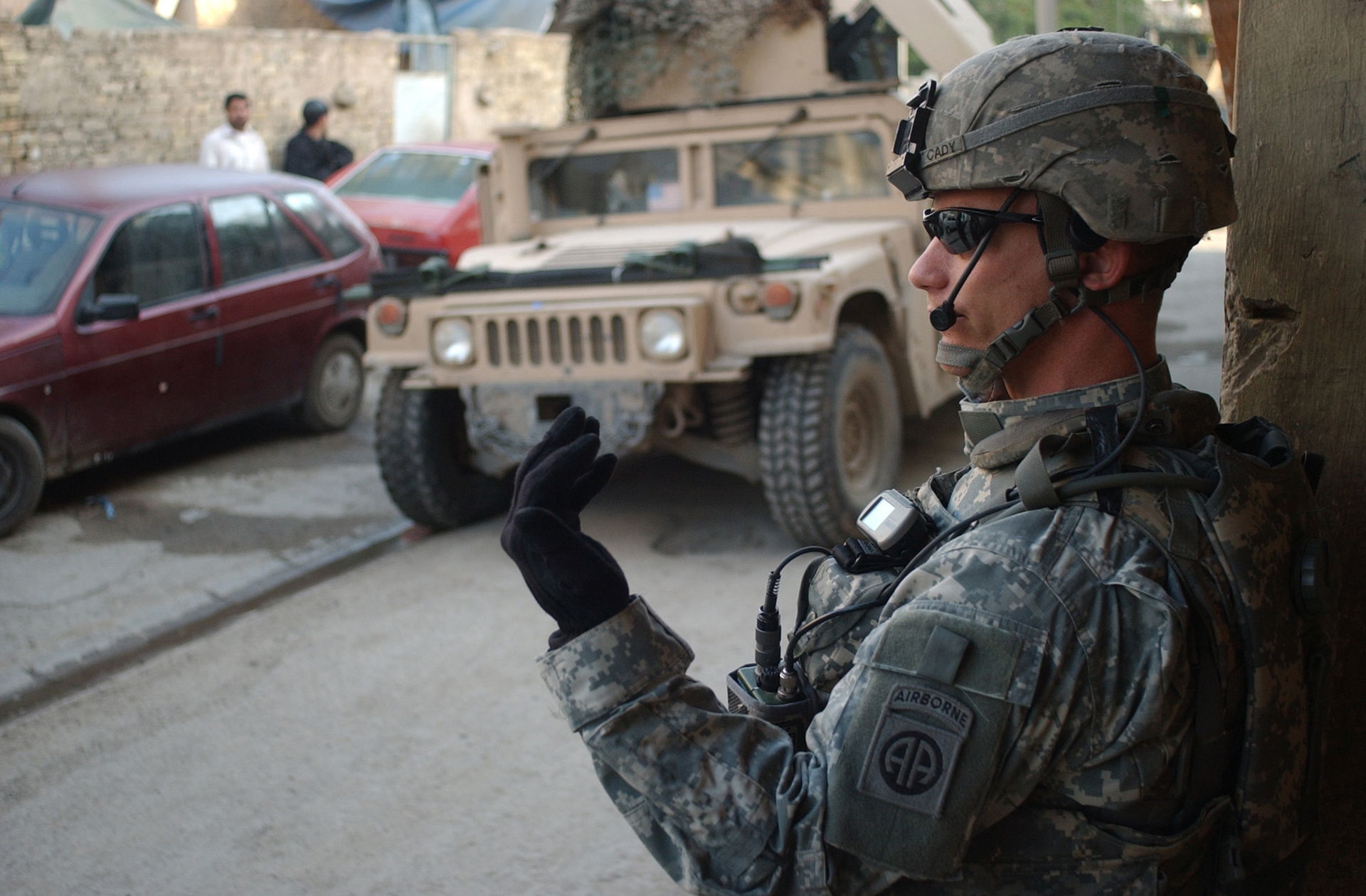 U.S. Army Staff Sgt. Brandon Cady motions his soldiers to come …