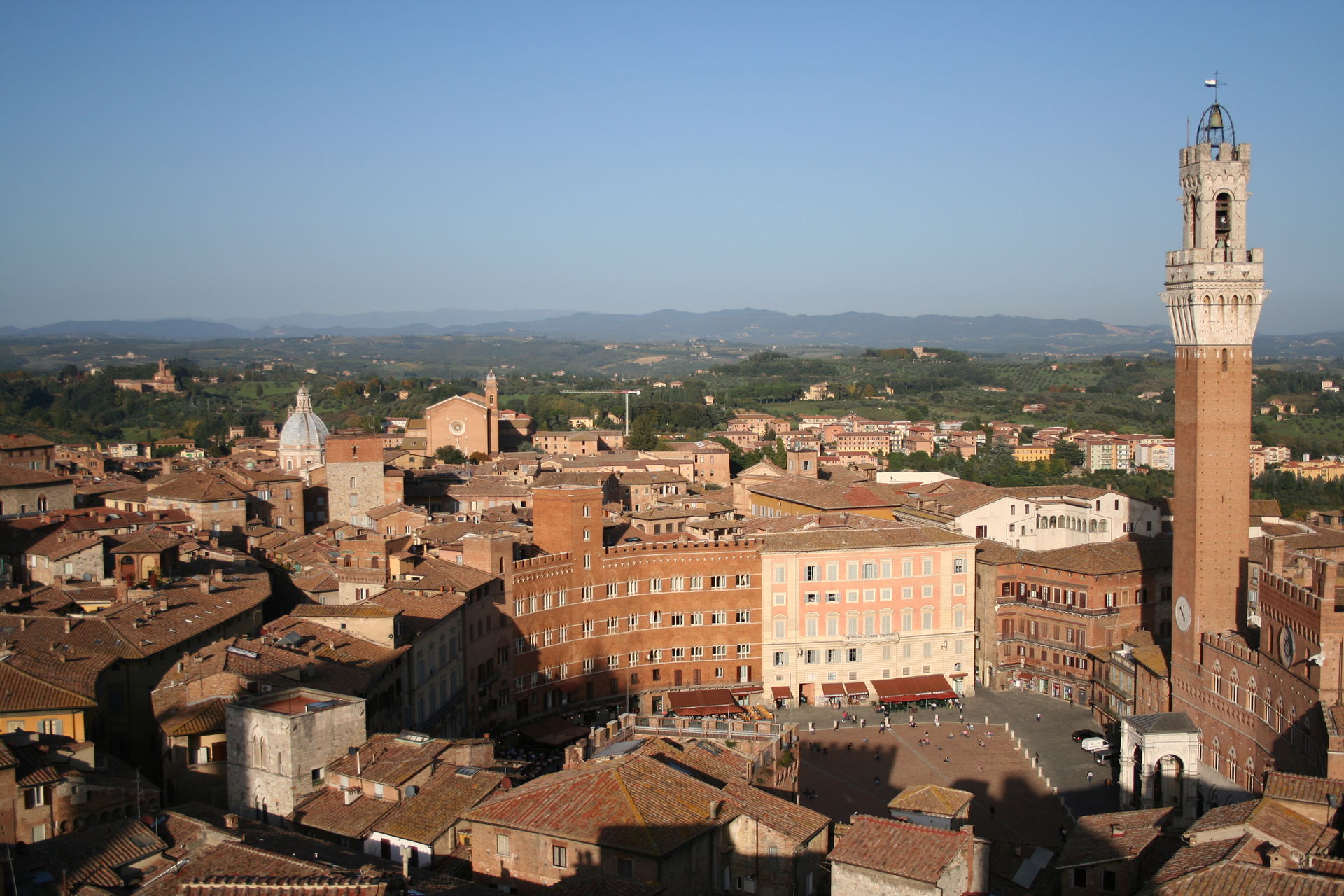 A photograph taken of the Piazza del Campo in Siena with tower …