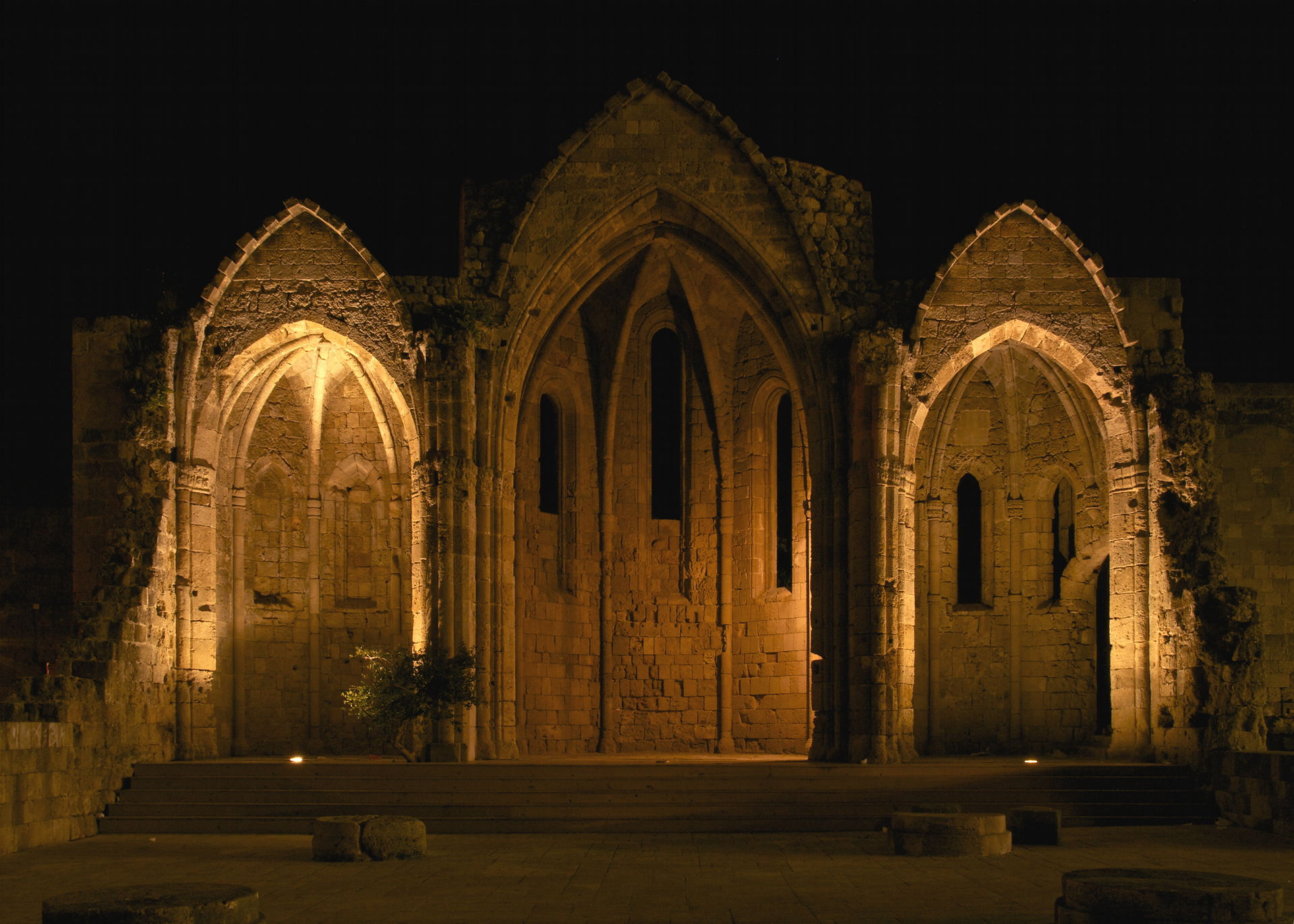 By night, the ruins of the choir of the church of the Virgin of…