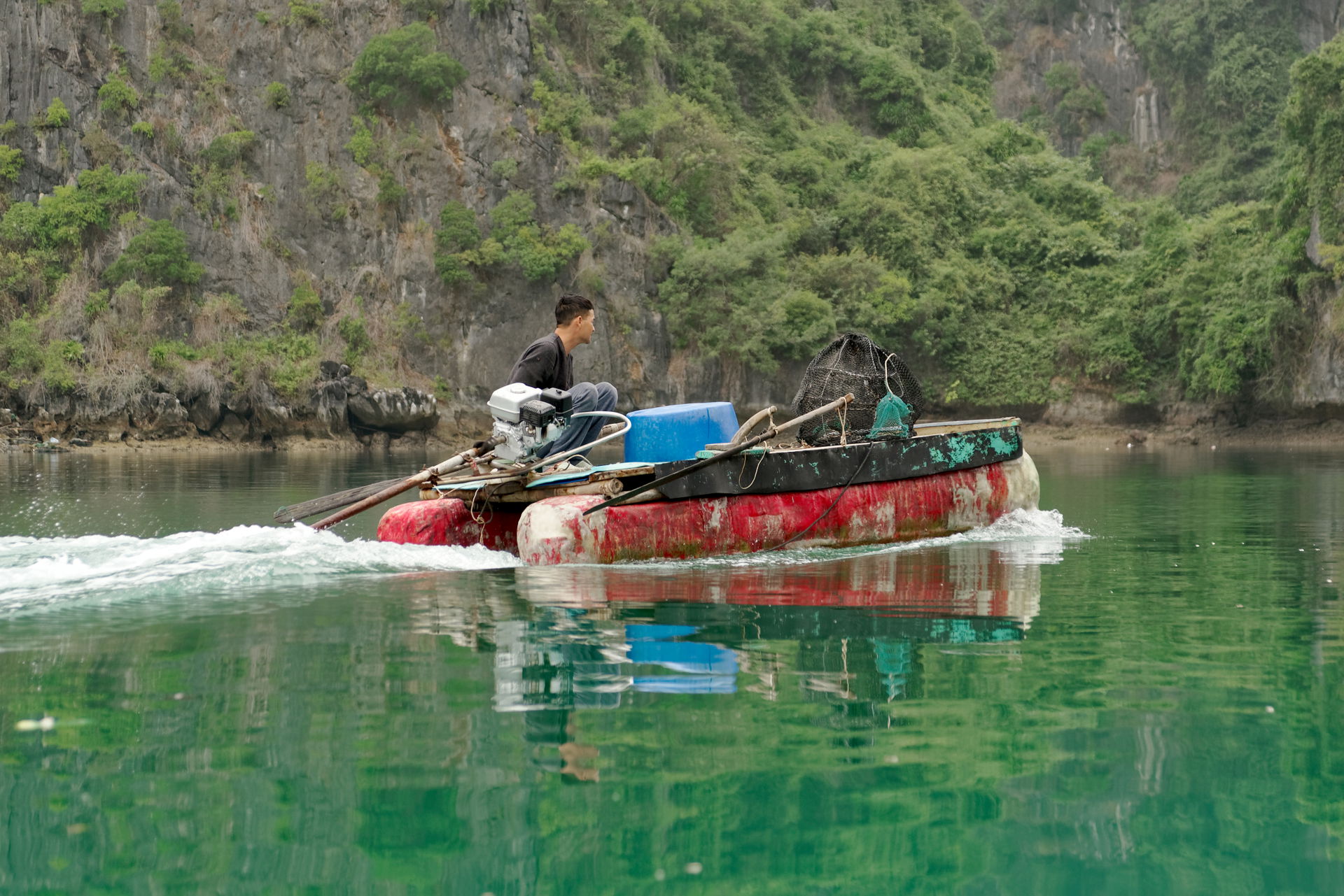 Fisherman boat near the coast of Cat Ba Island, Vietnam