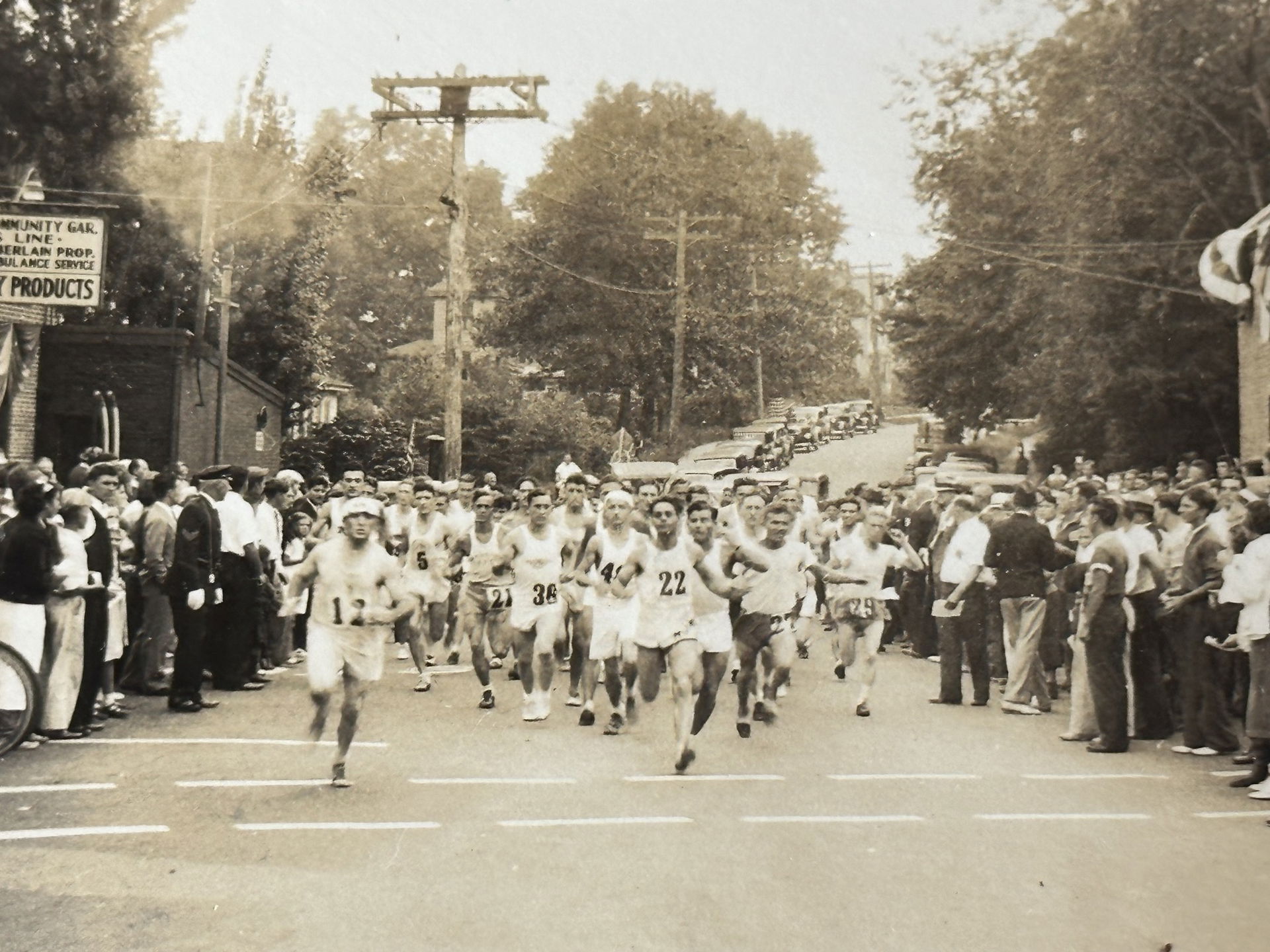 Runners, including Tarzan Brown (22), at the start of a 9.5 mil…
