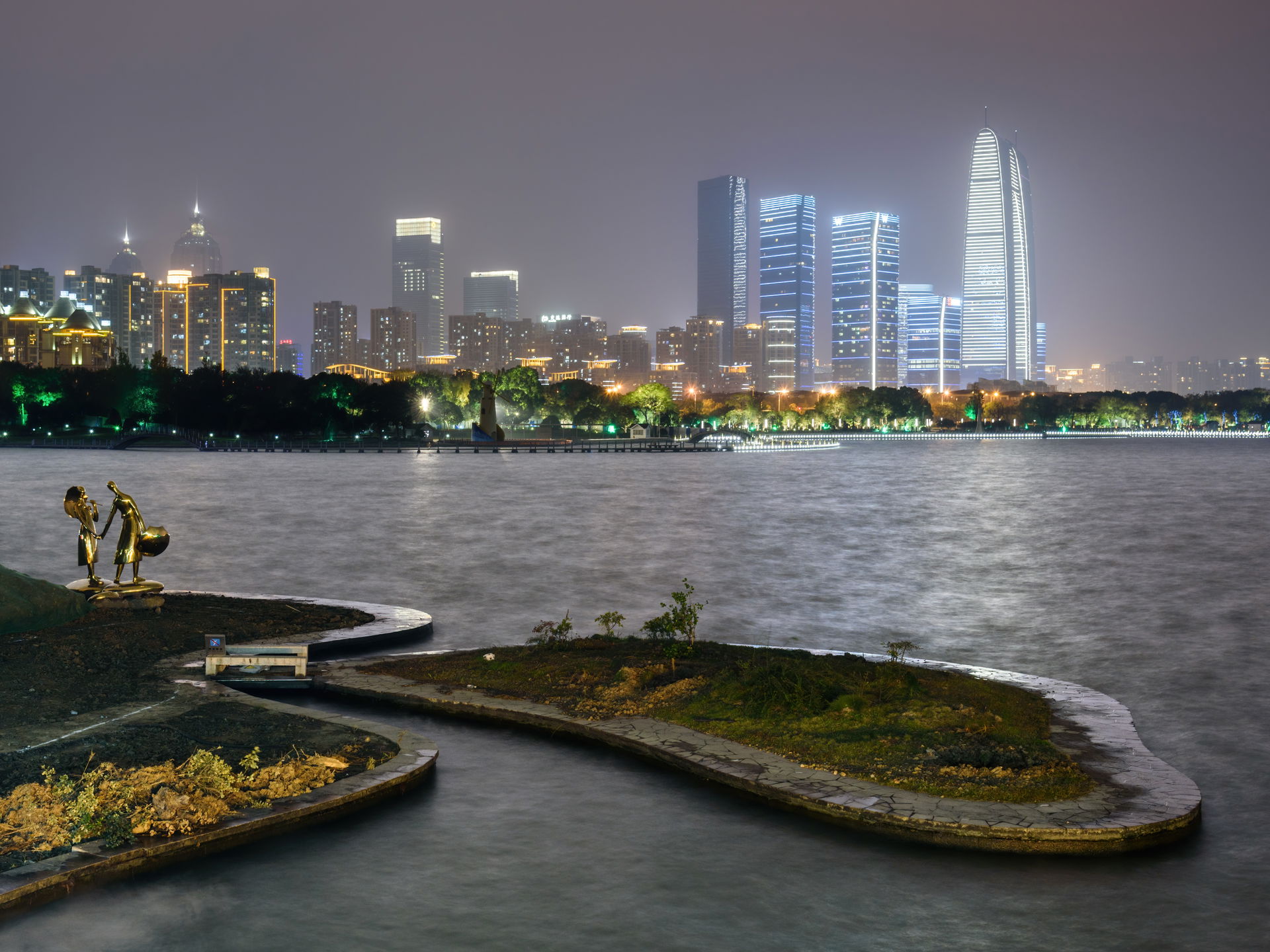 City skyline across Jinji Lake, Suzhou, China.