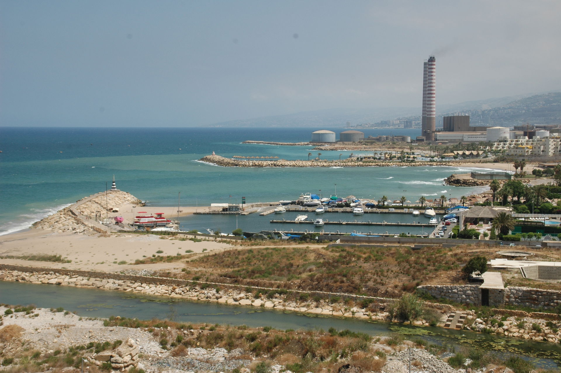 Coast north of the Nahr al-Kalb (river mouth, foreground) and Z…