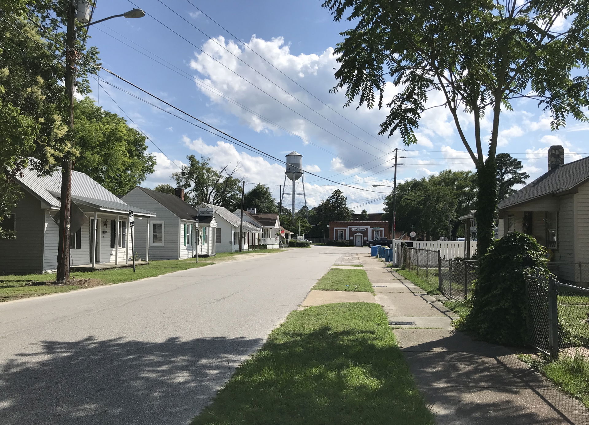 Residential street in Hope Mills with Gardner Building in backg…