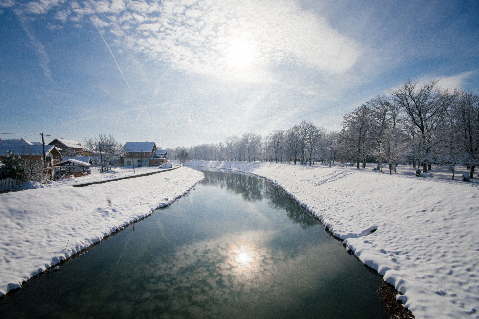 River path with coasts covered in snow. River Mlava in Petrovac…