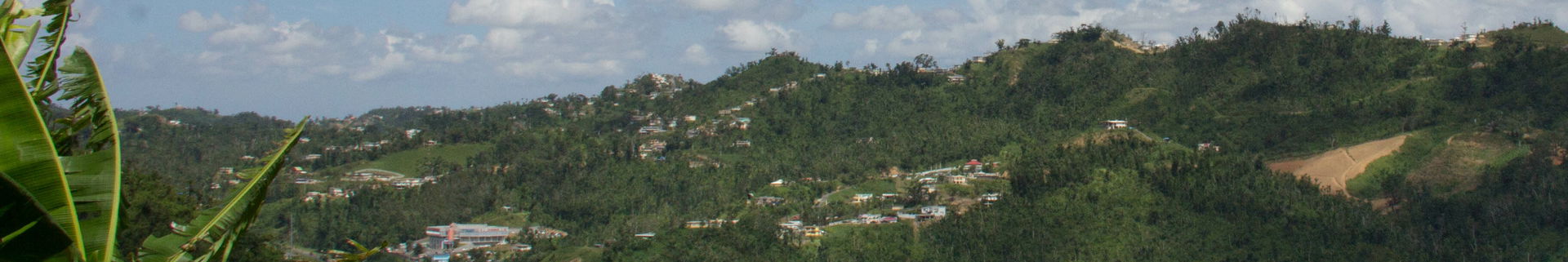 A Puerto Rican flag flies at a home in one of the mountain-top …