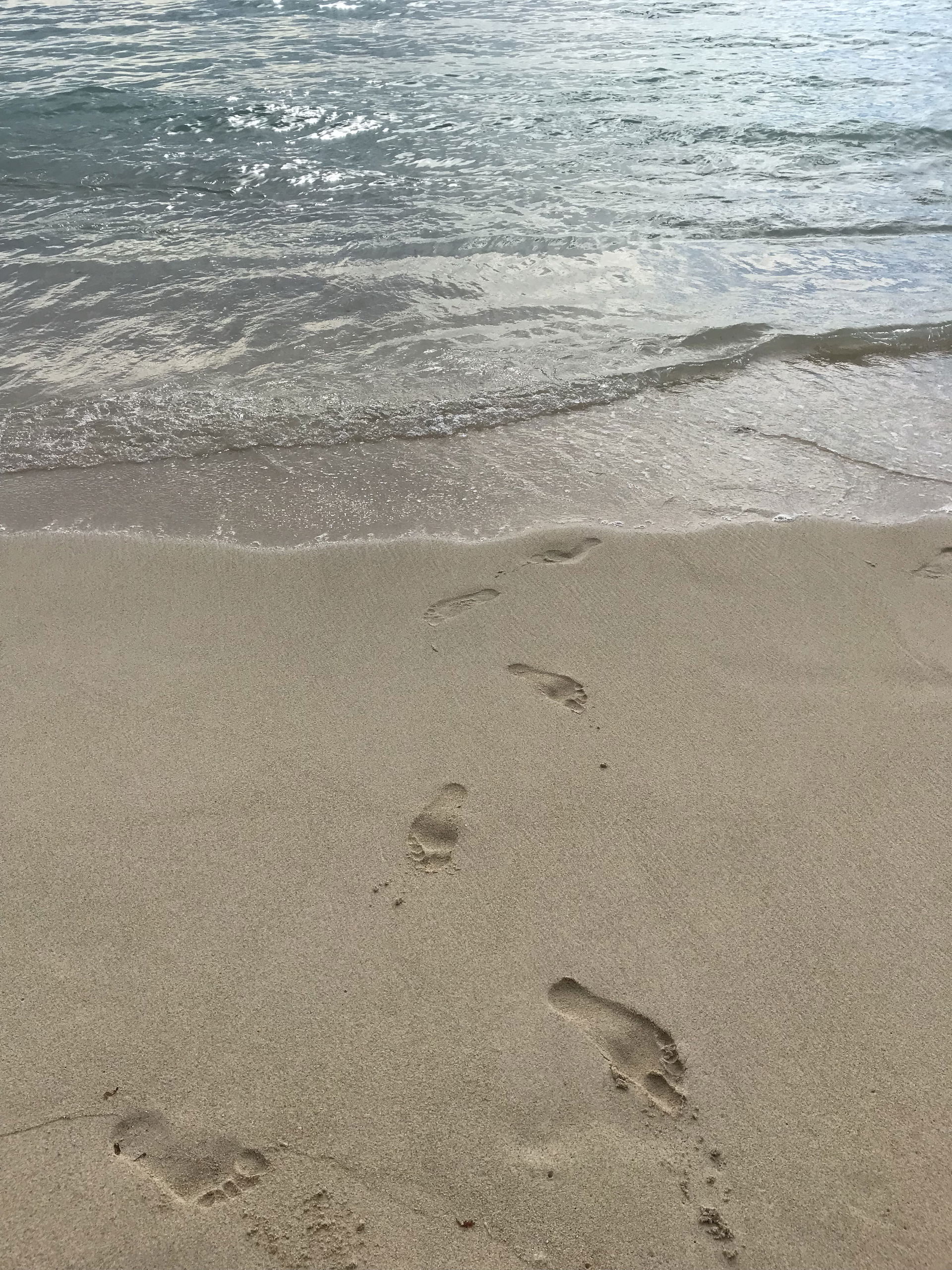 Footprints on beach of Flic-en-Flac (Mauritius) in 2018.