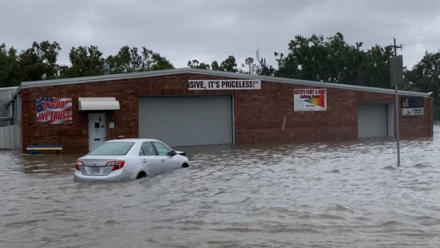 A flooded parking lot outside a business in Lake Charles, Louis…