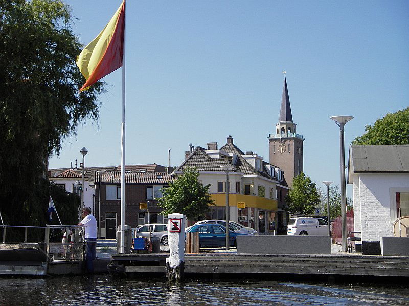View on Valkenburg, zuid-holland. Churchtower and ferry, seen f…