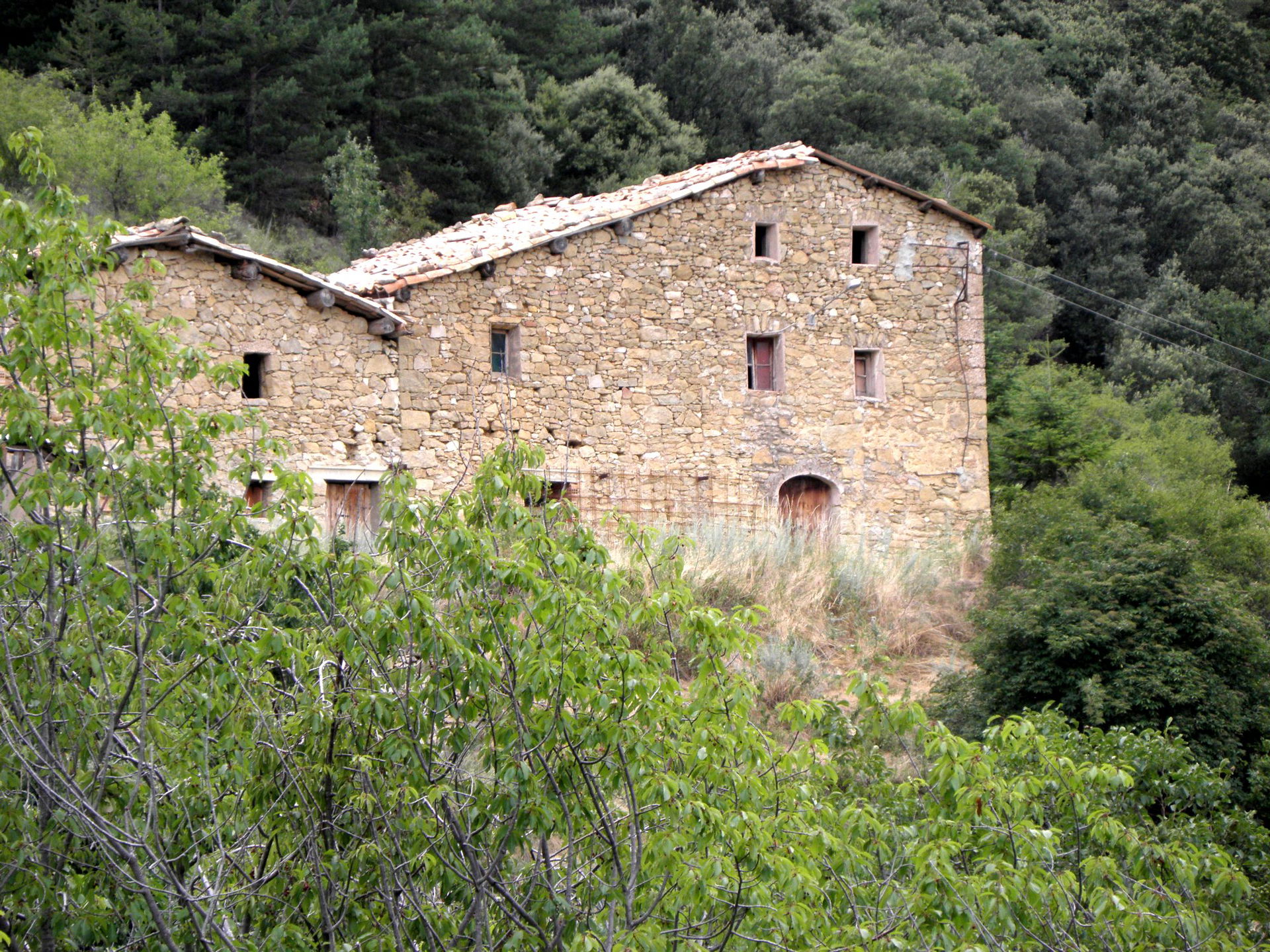 La masia de Cal Voluntari, al poble de la Coma (municipi de la …