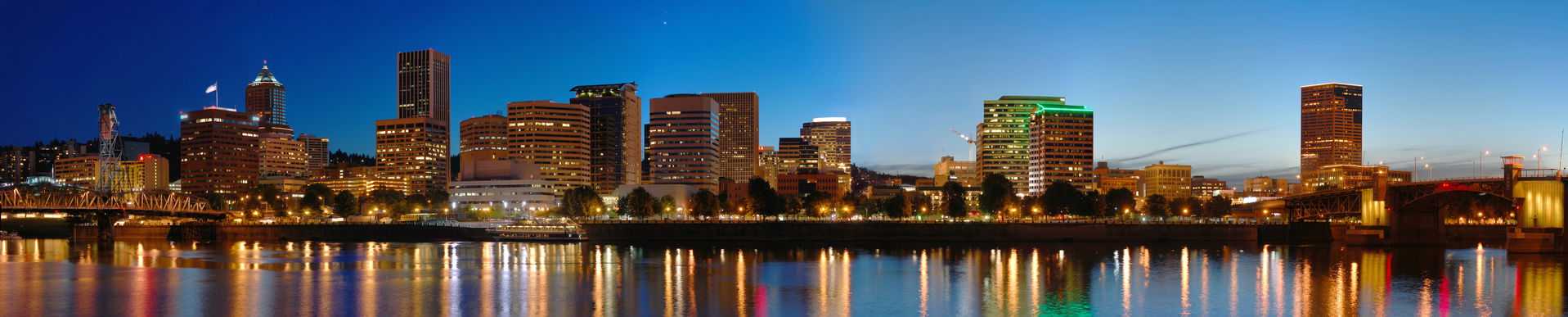 A stitched panorama of downtown Portland, OR at night.