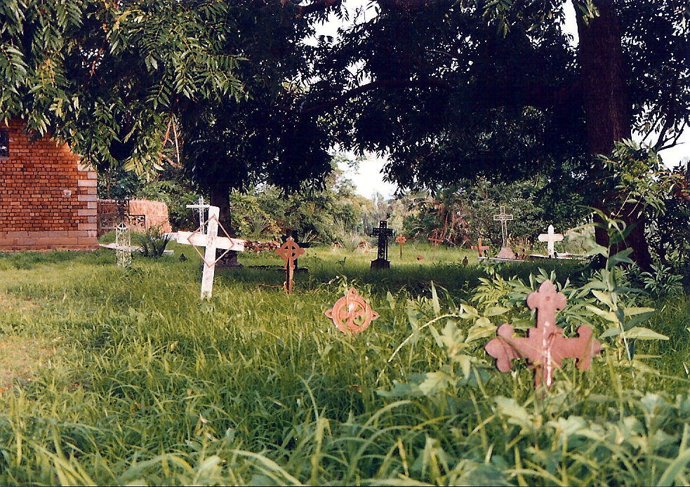 Cemetery by the Christian church (visible to left) in Nkhotakot…