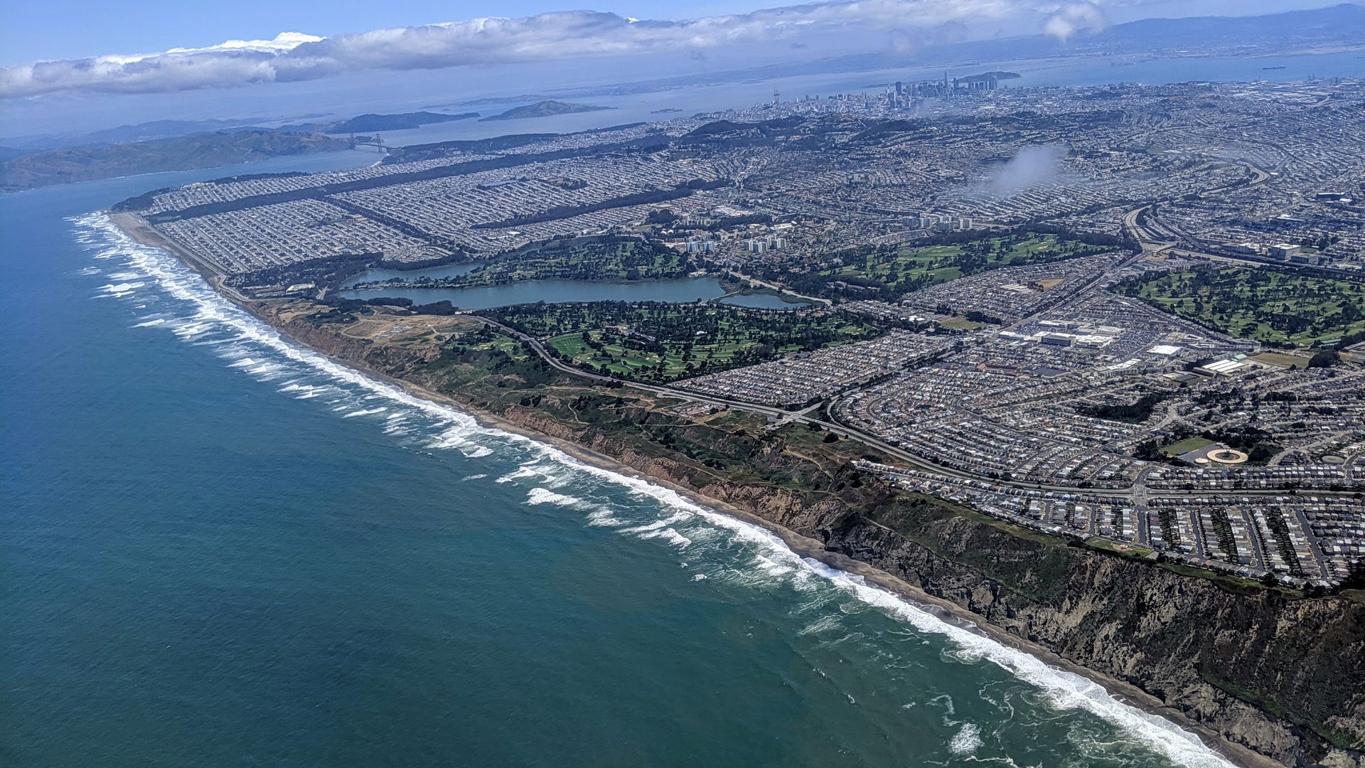 Aerial view from the southwest of Westlake (right foreground), …