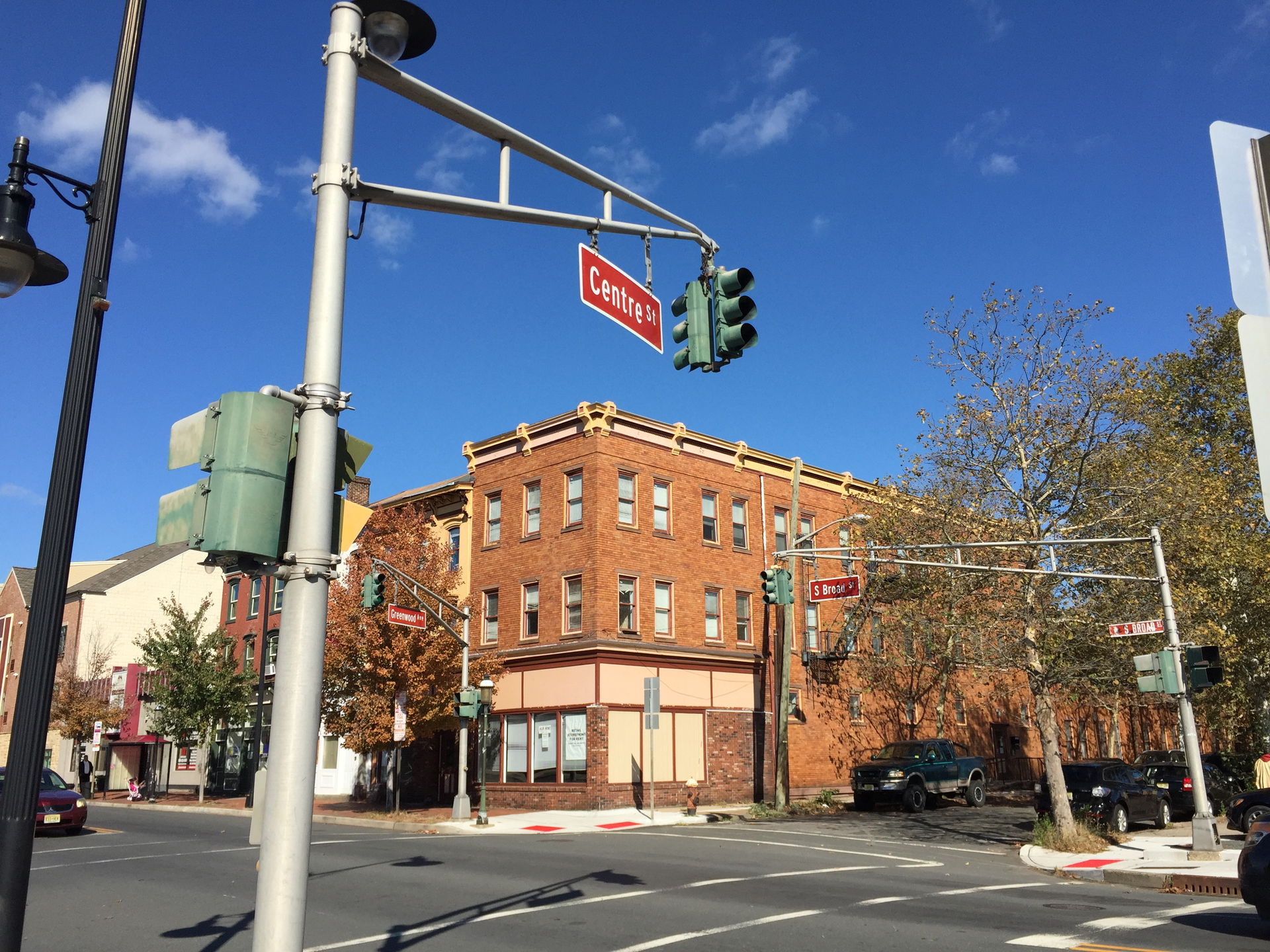 Old green-painted traffic signal at the intersection of U.S. Ro…