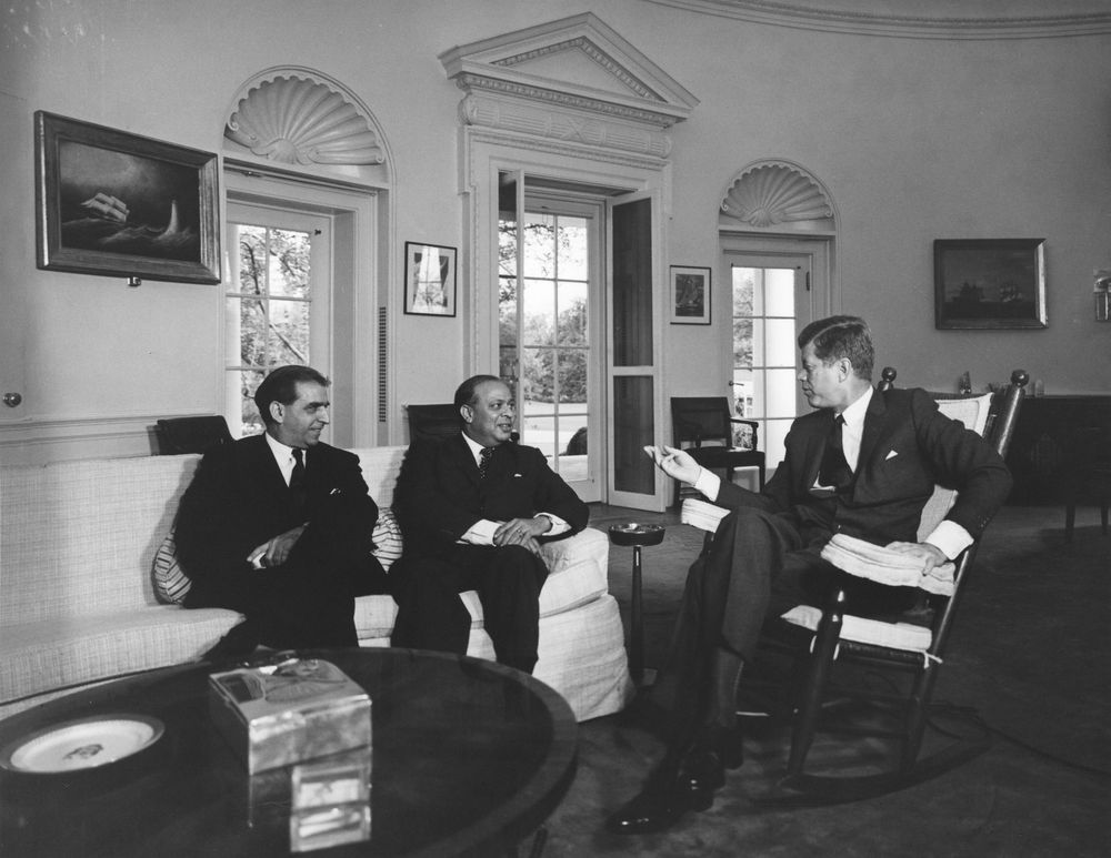 President John F. Kennedy (in rocking chair) meets with Ministe…