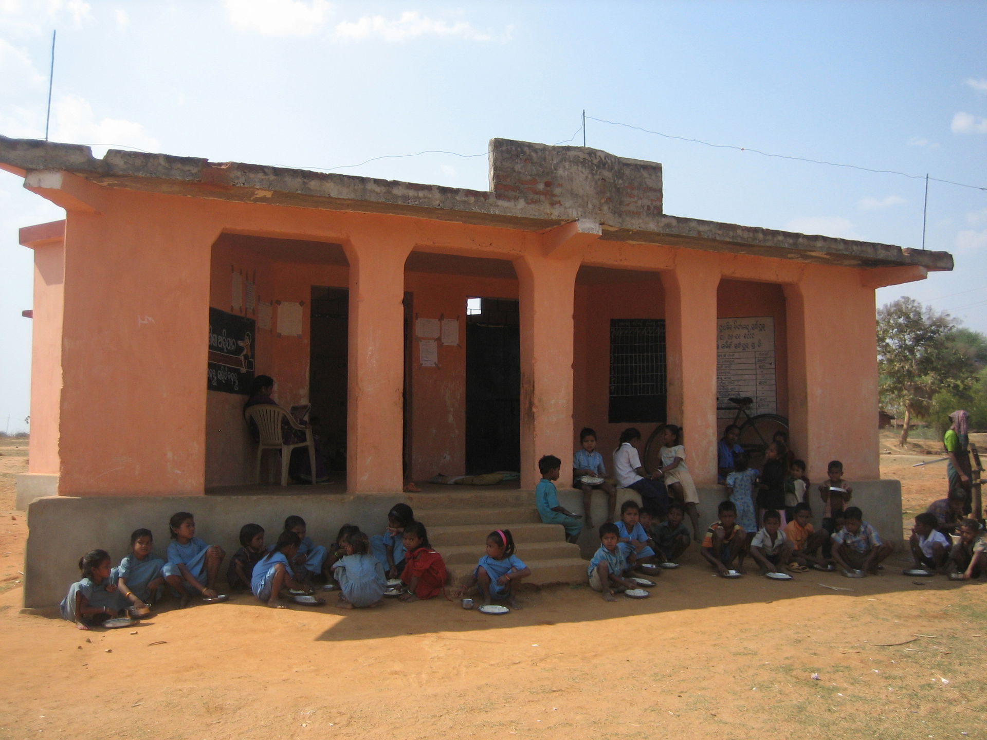 School children at lunch outside a one room primary school (nea…