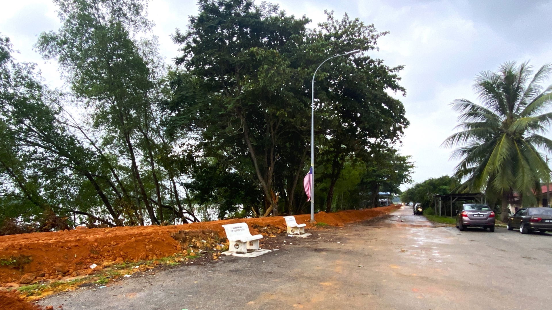 Bund construction along the banks of the Perak River at Kampung…