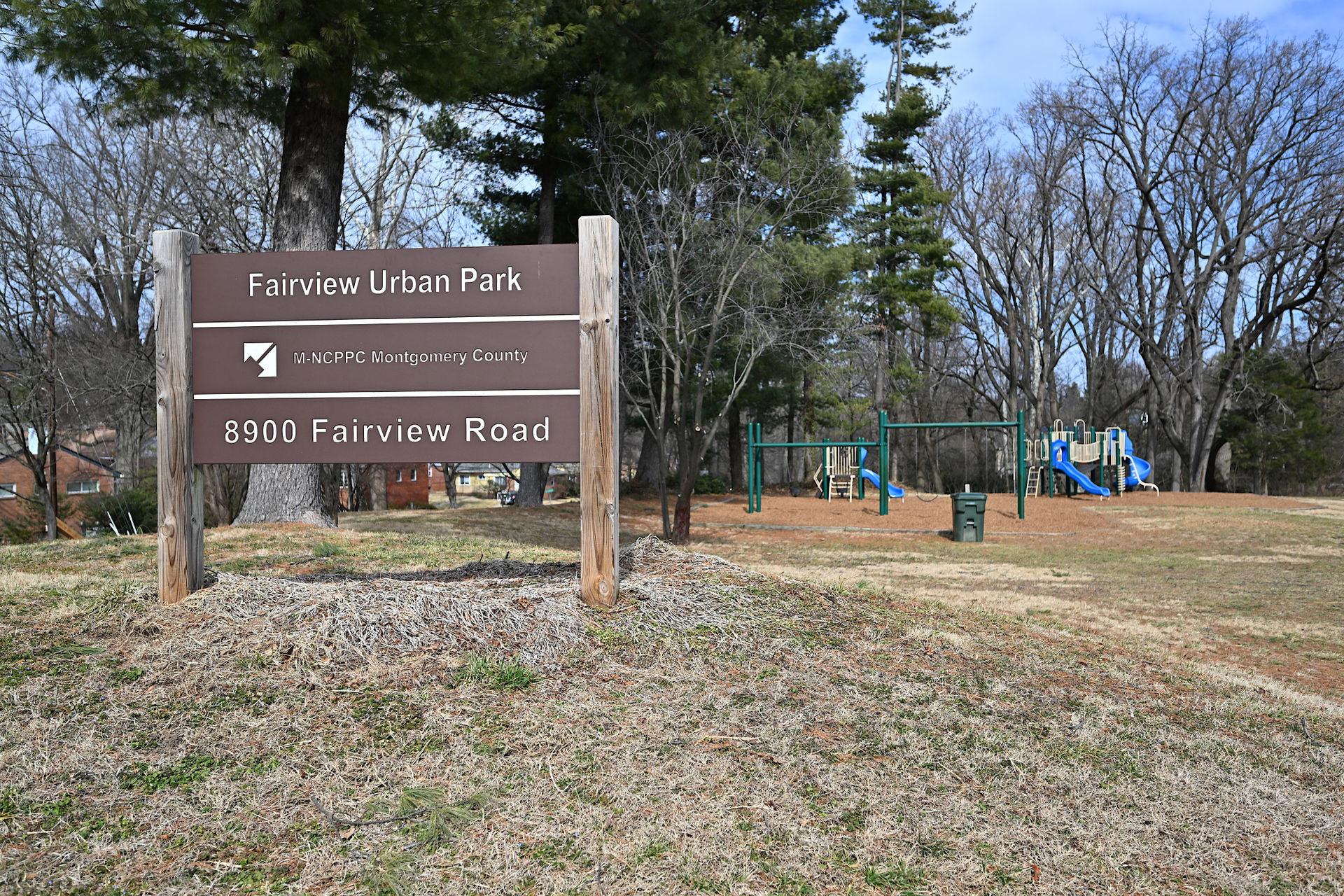 The sign for Fairview Urban Park with some playground equipment…