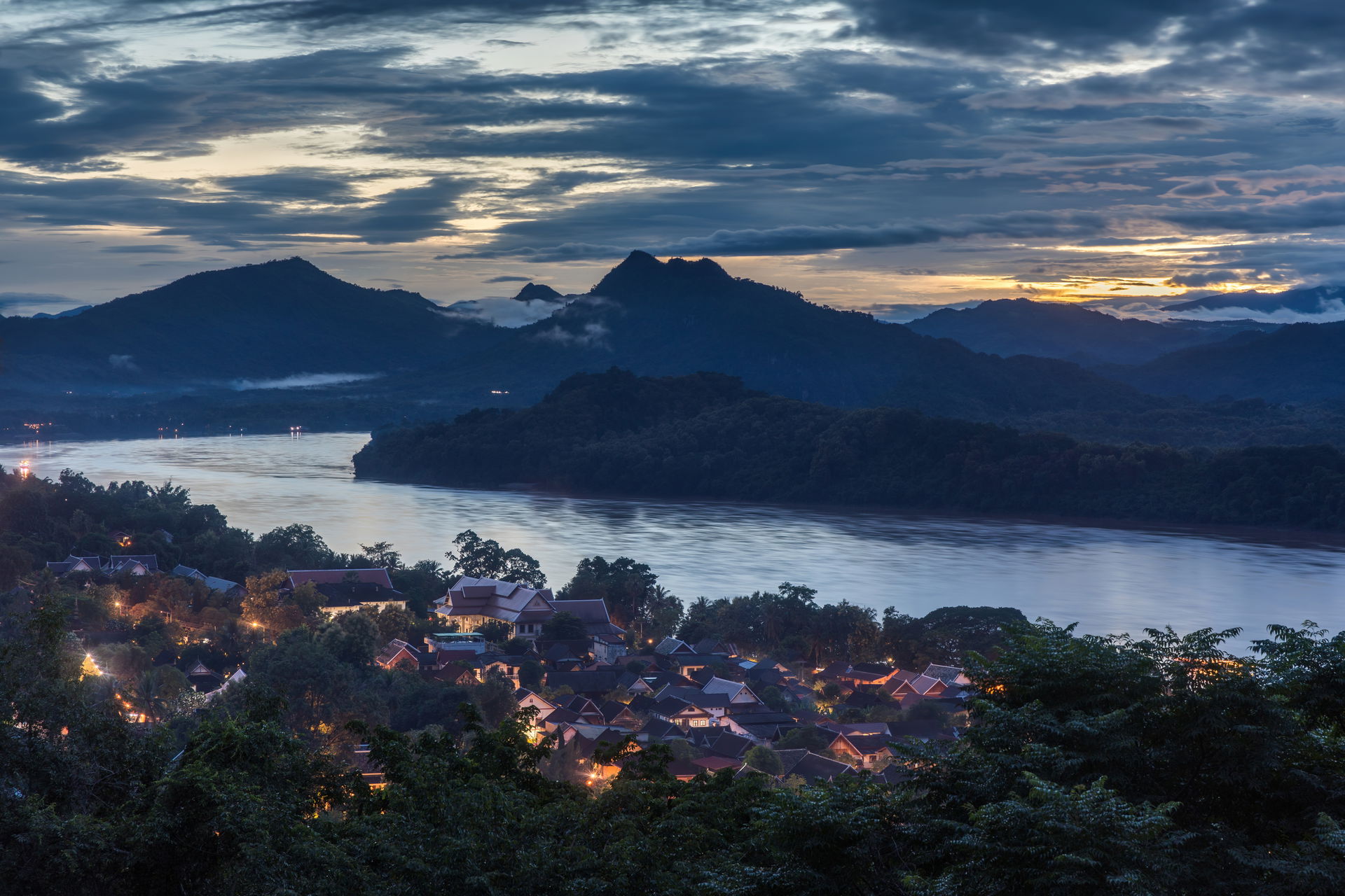 Mountains, Mekong river and dwellings, seen from Mount Phou Si …