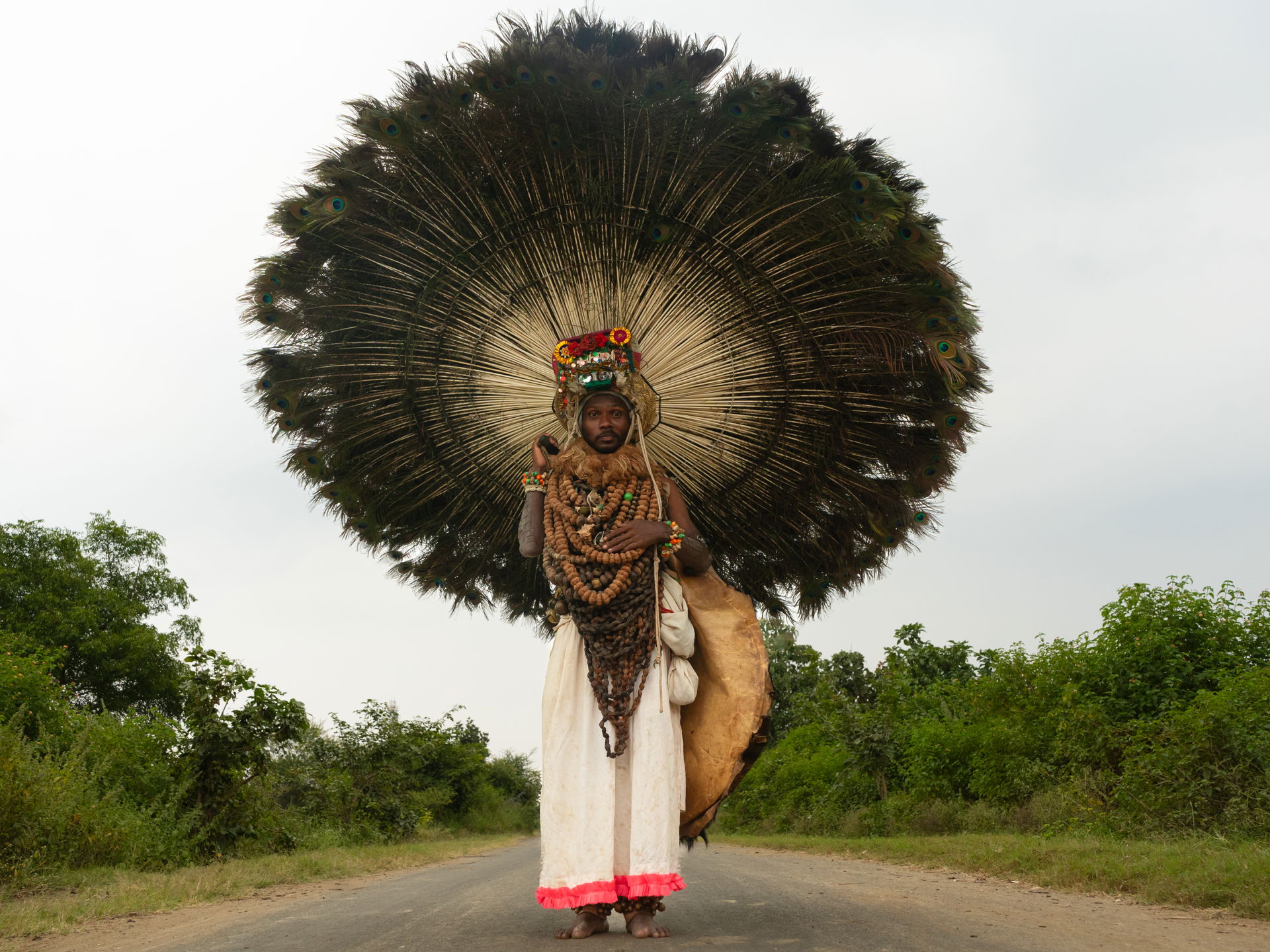 A Gussadi dancer captured on a road near Jainoor