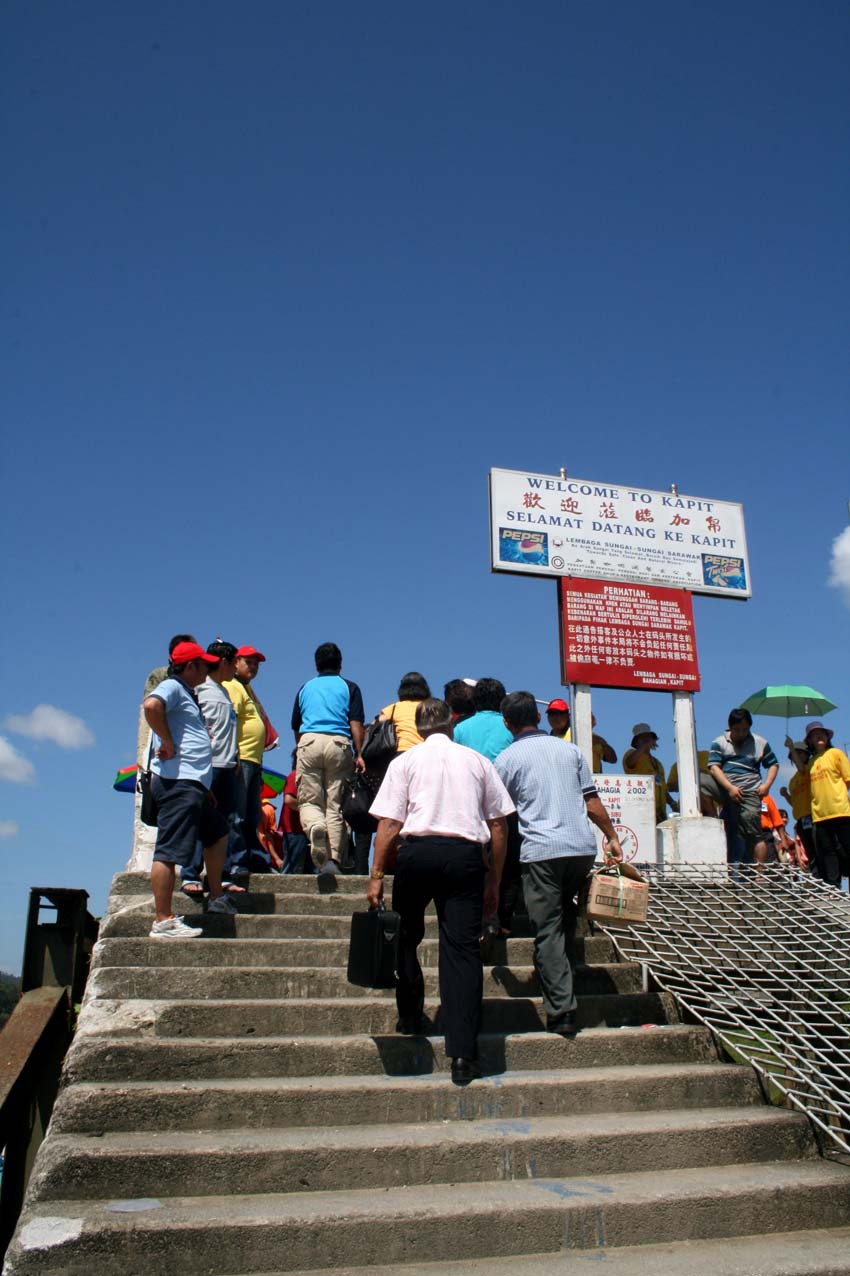 Going upstairs on the Kapit wharf after unloading from the boat…